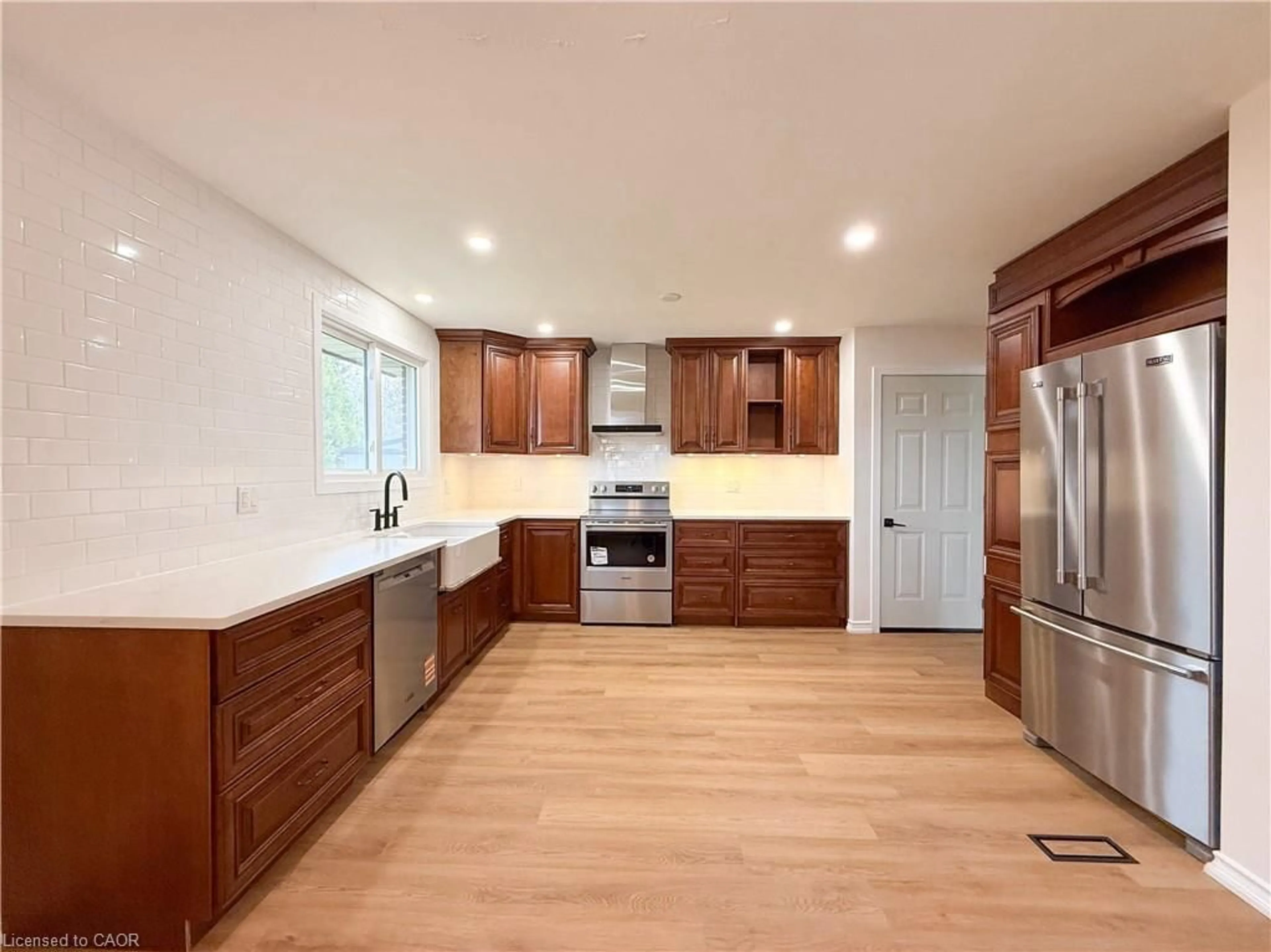 Open concept kitchen, wood/laminate floor for 14 Orchard Cres, Waterford Ontario N0E 1Y0