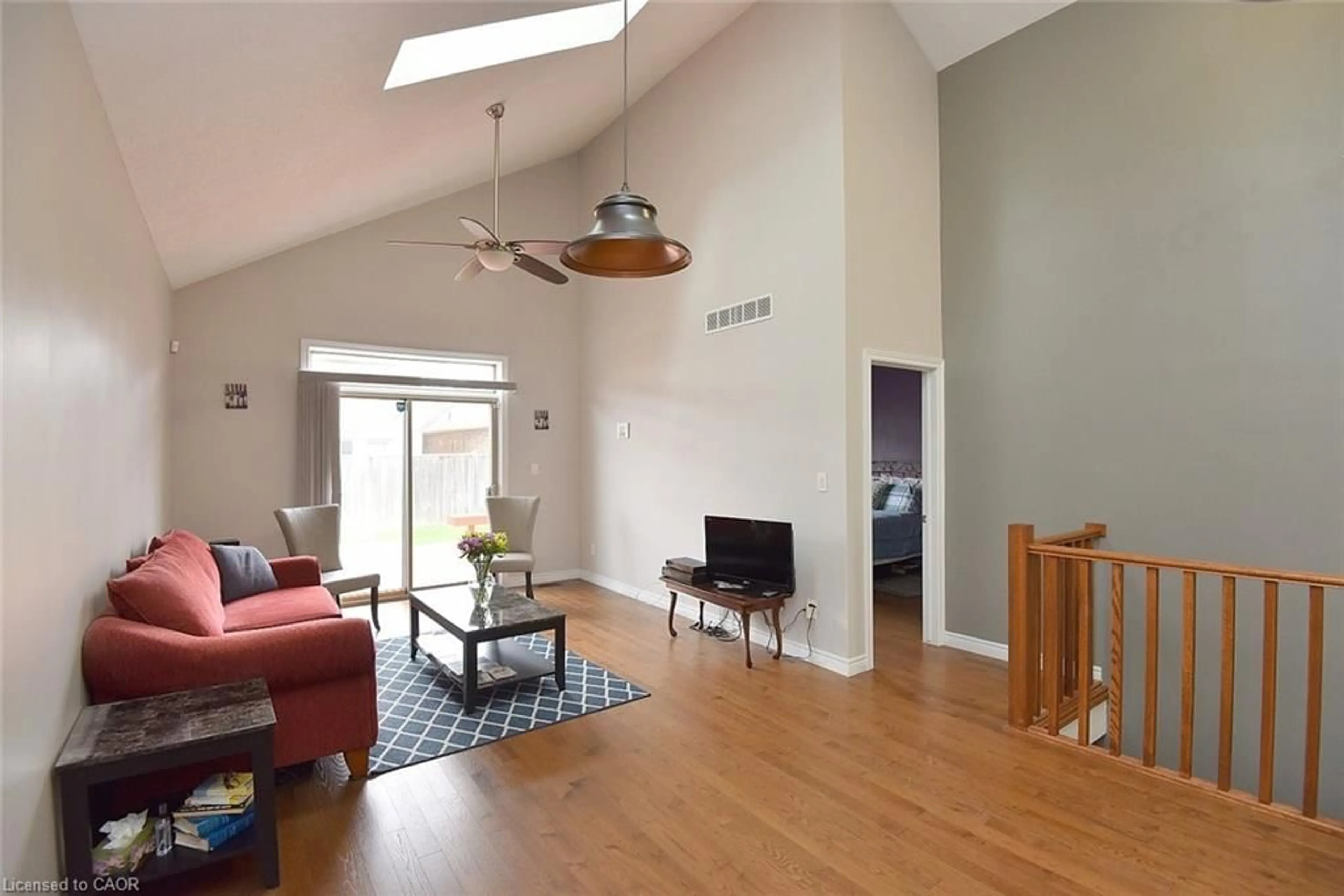 Living room with furniture, wood/laminate floor for 27 Banks St, Brantford Ontario N3T 0H7