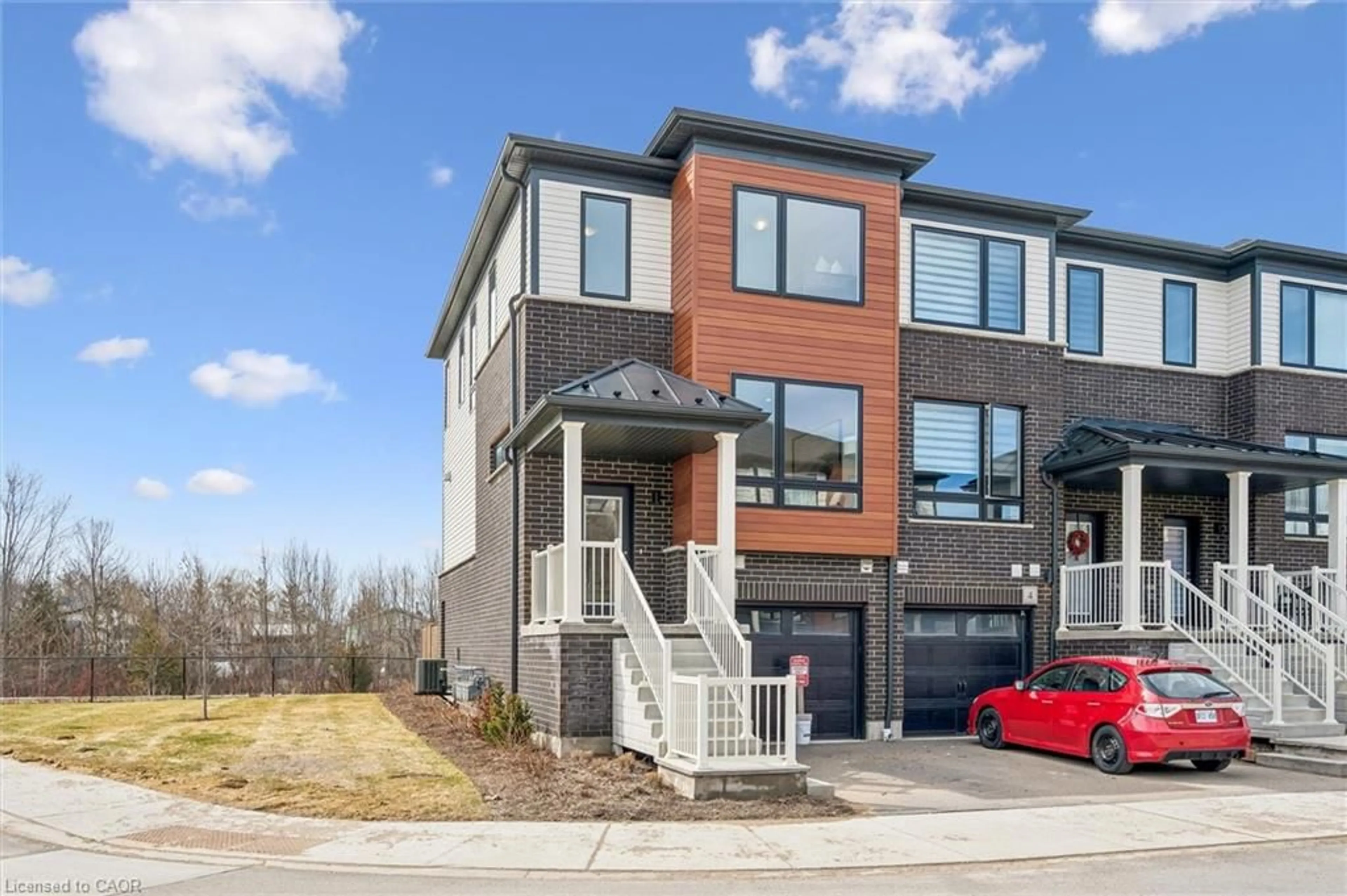 Home with brick exterior material, street for 2 Sora Lane, Guelph Ontario N1E 0T4