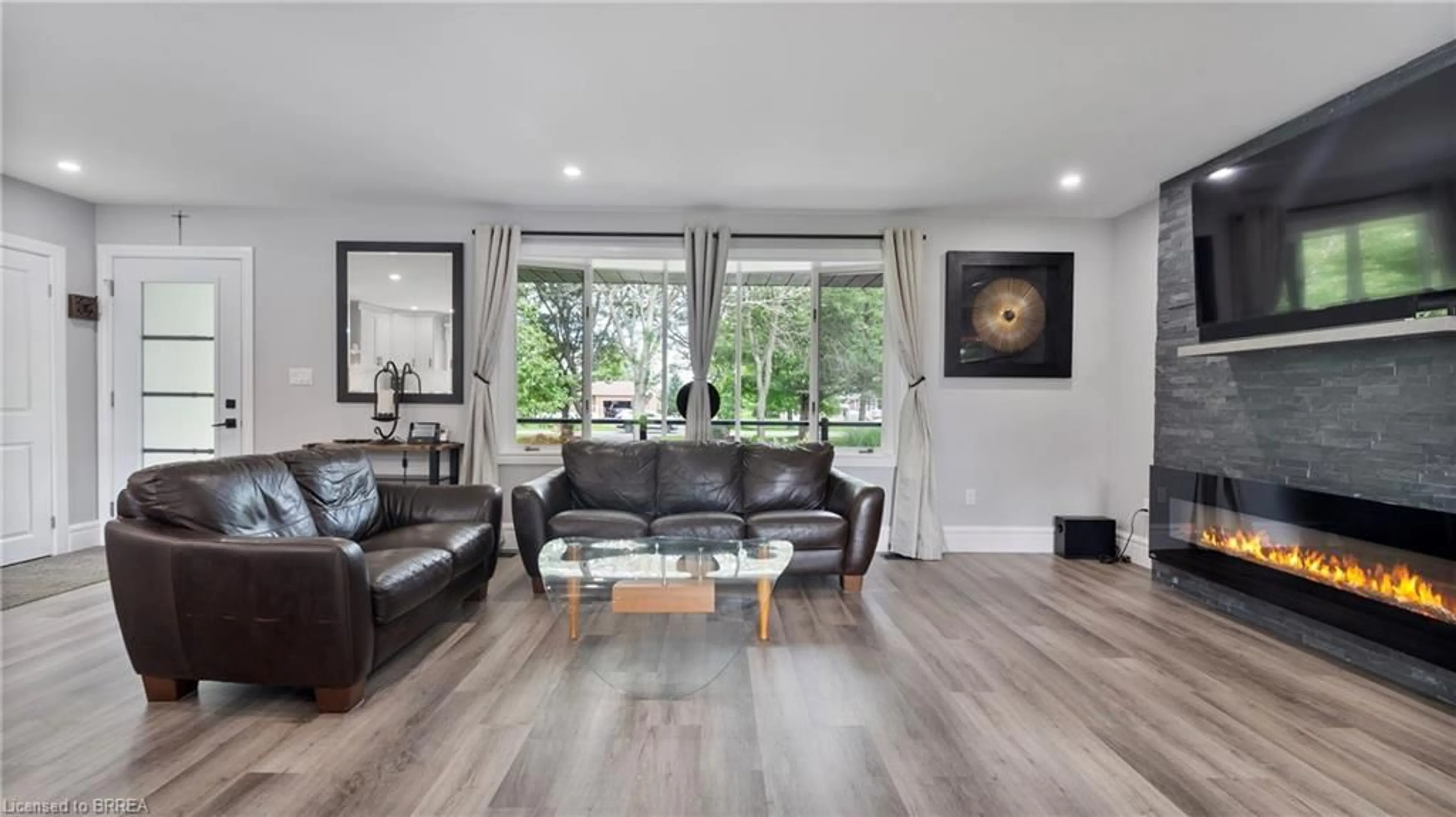 Living room with furniture, wood/laminate floor for 1651 Villa Nova Rd, Wilsonville Ontario N0E 1Z0