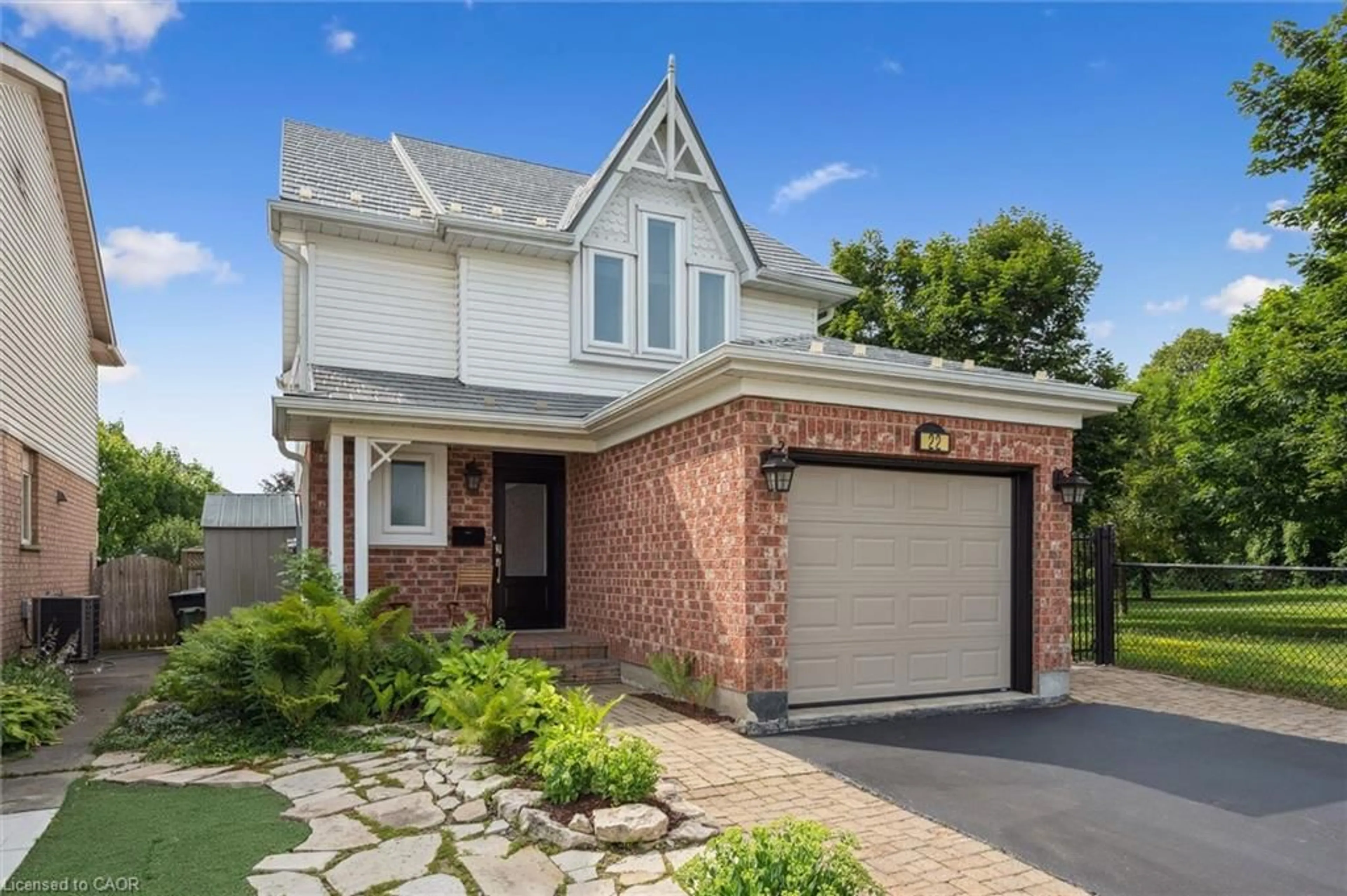 Home with brick exterior material, street for 22 Thompson Dr, Guelph Ontario N1E 7A5