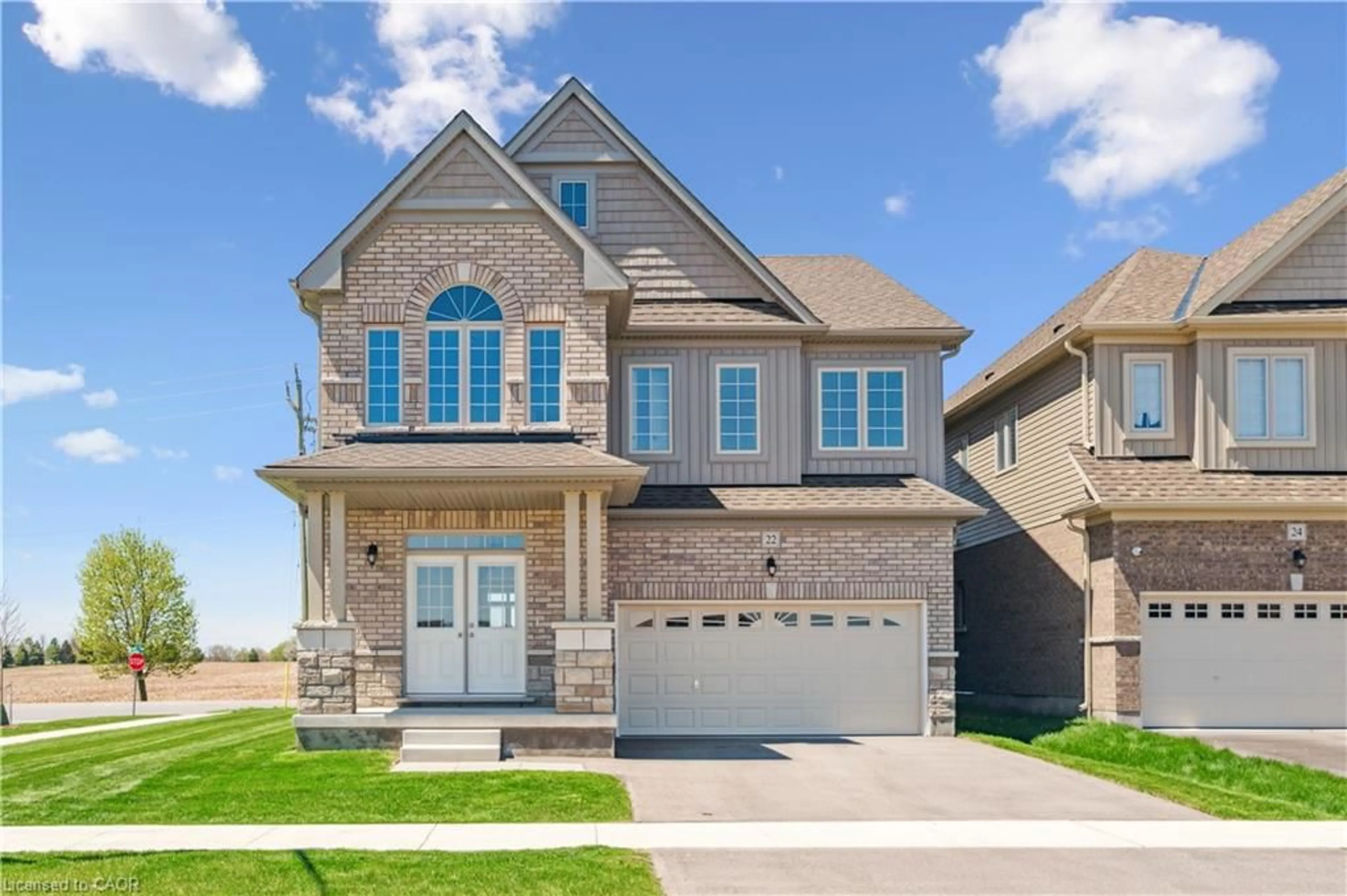 Home with brick exterior material, street for 22 Henry Maracle St, Ayr Ontario N0B 1E0