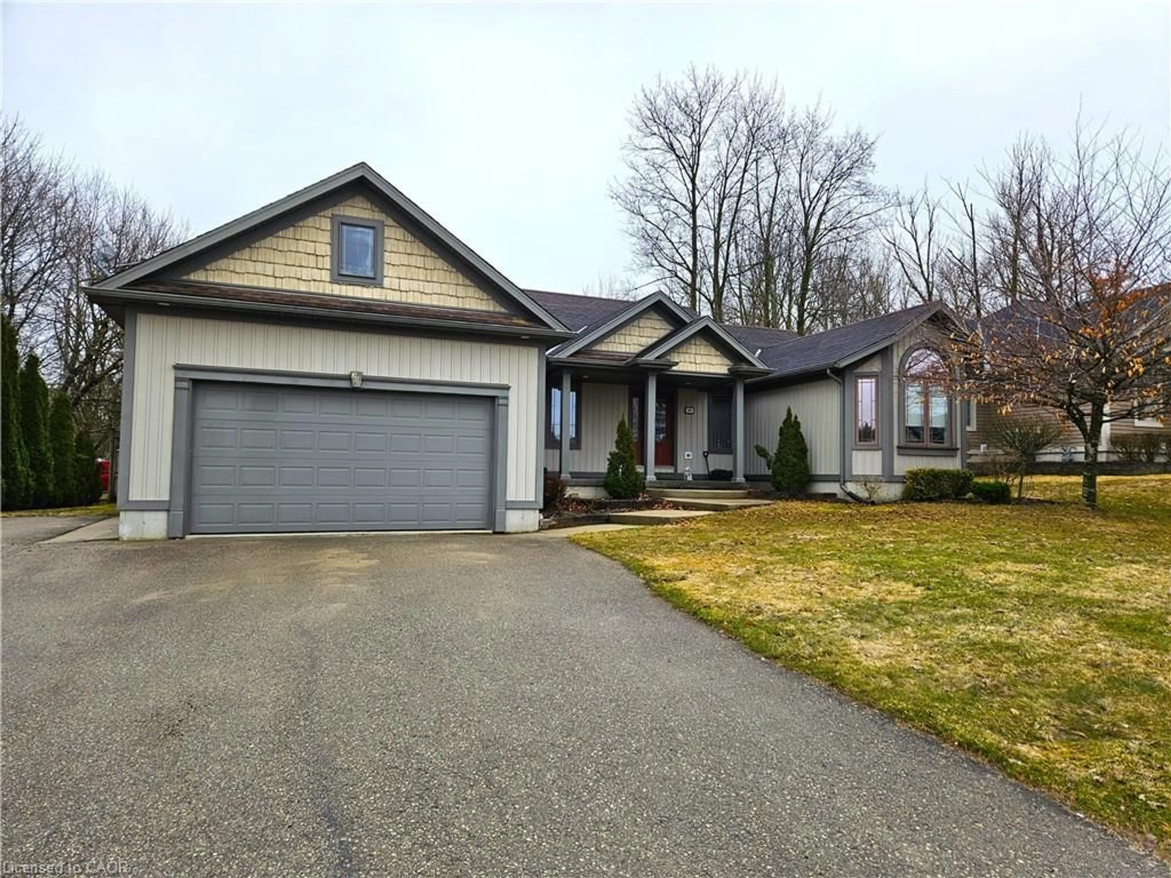 Home with vinyl exterior material, street for 300 Durham St, Mount Forest Ontario N0G 2L1