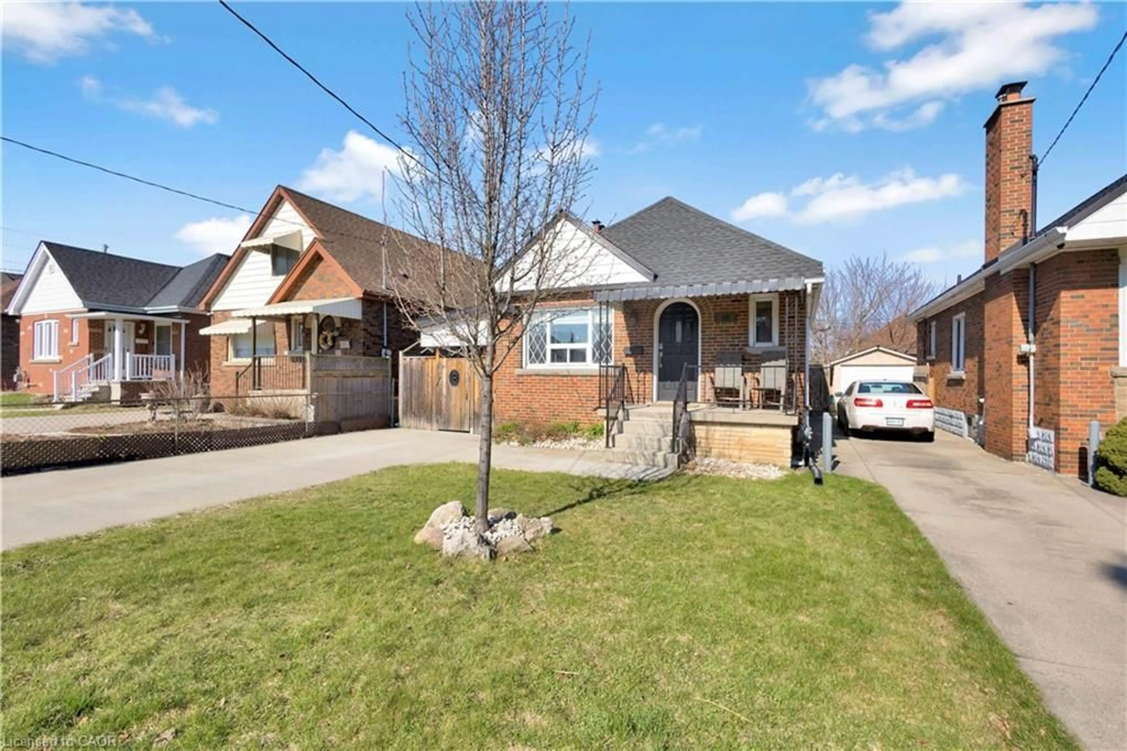 Home with brick exterior material, street for 20 Barons Ave, Hamilton Ontario L8K 2X9