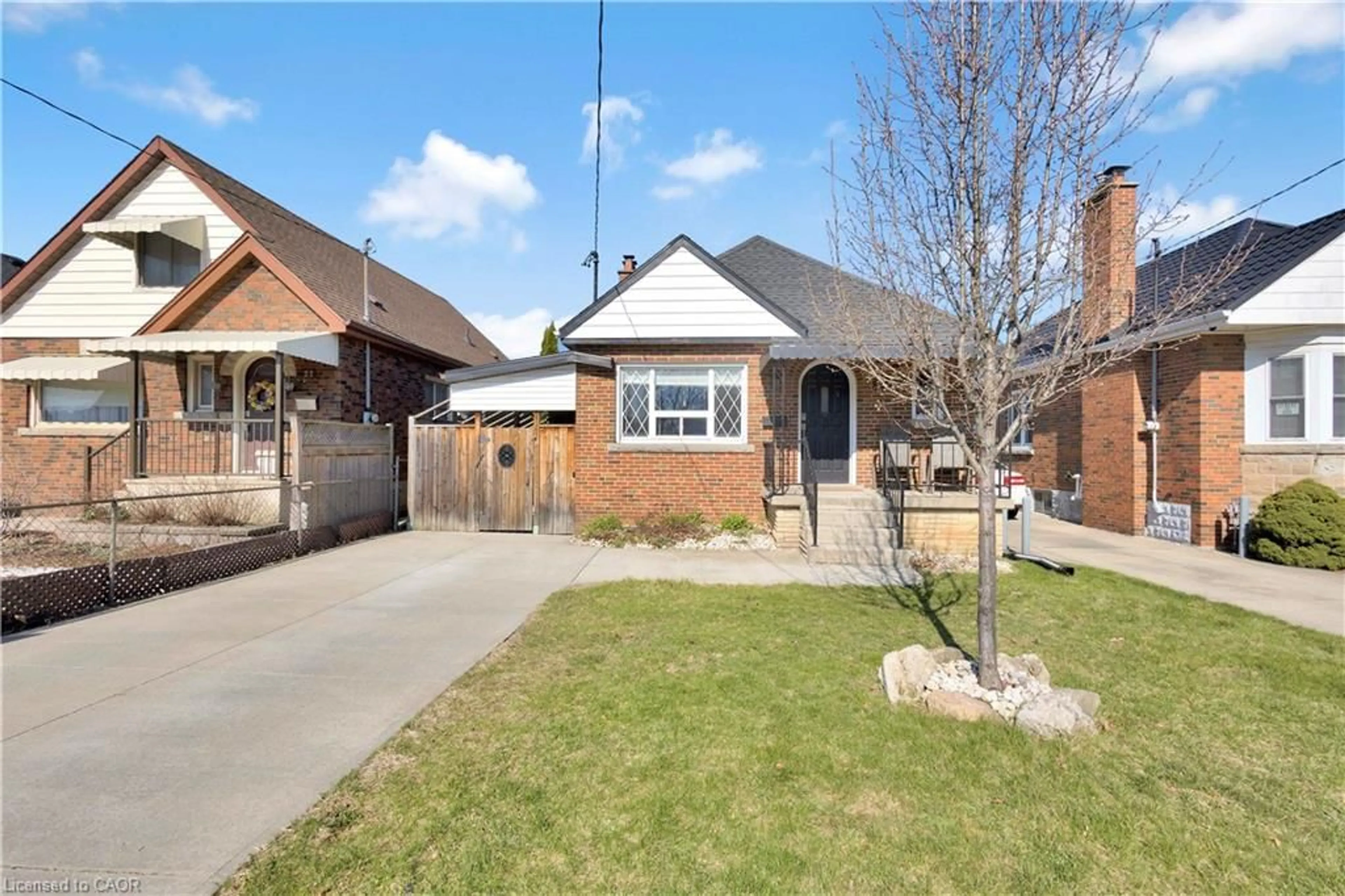 Home with brick exterior material, street for 20 Barons Ave, Hamilton Ontario L8K 2X9