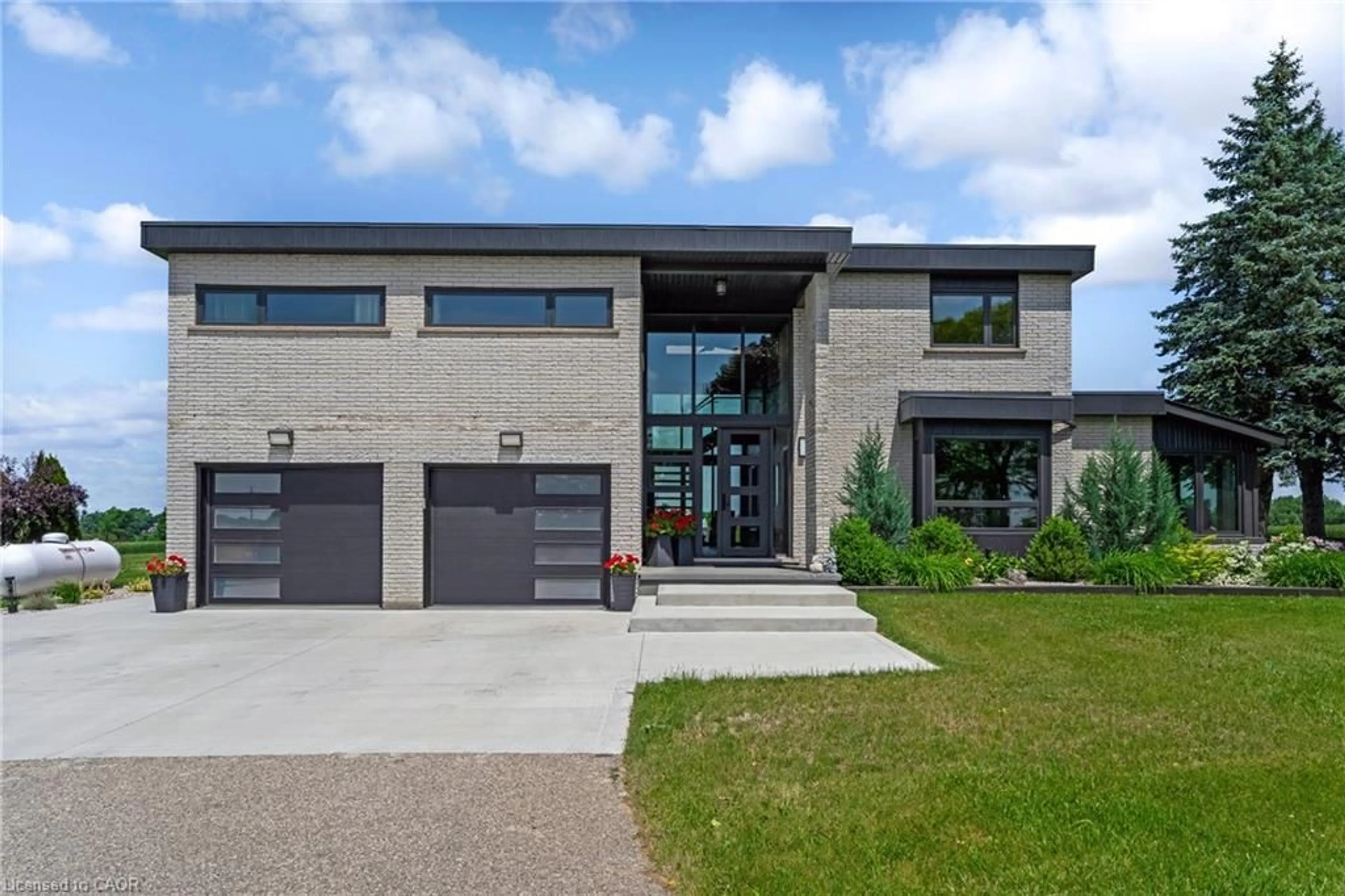 Home with brick exterior material, street for 8312 Wellington Road 124, Guelph Ontario N1H 6H7