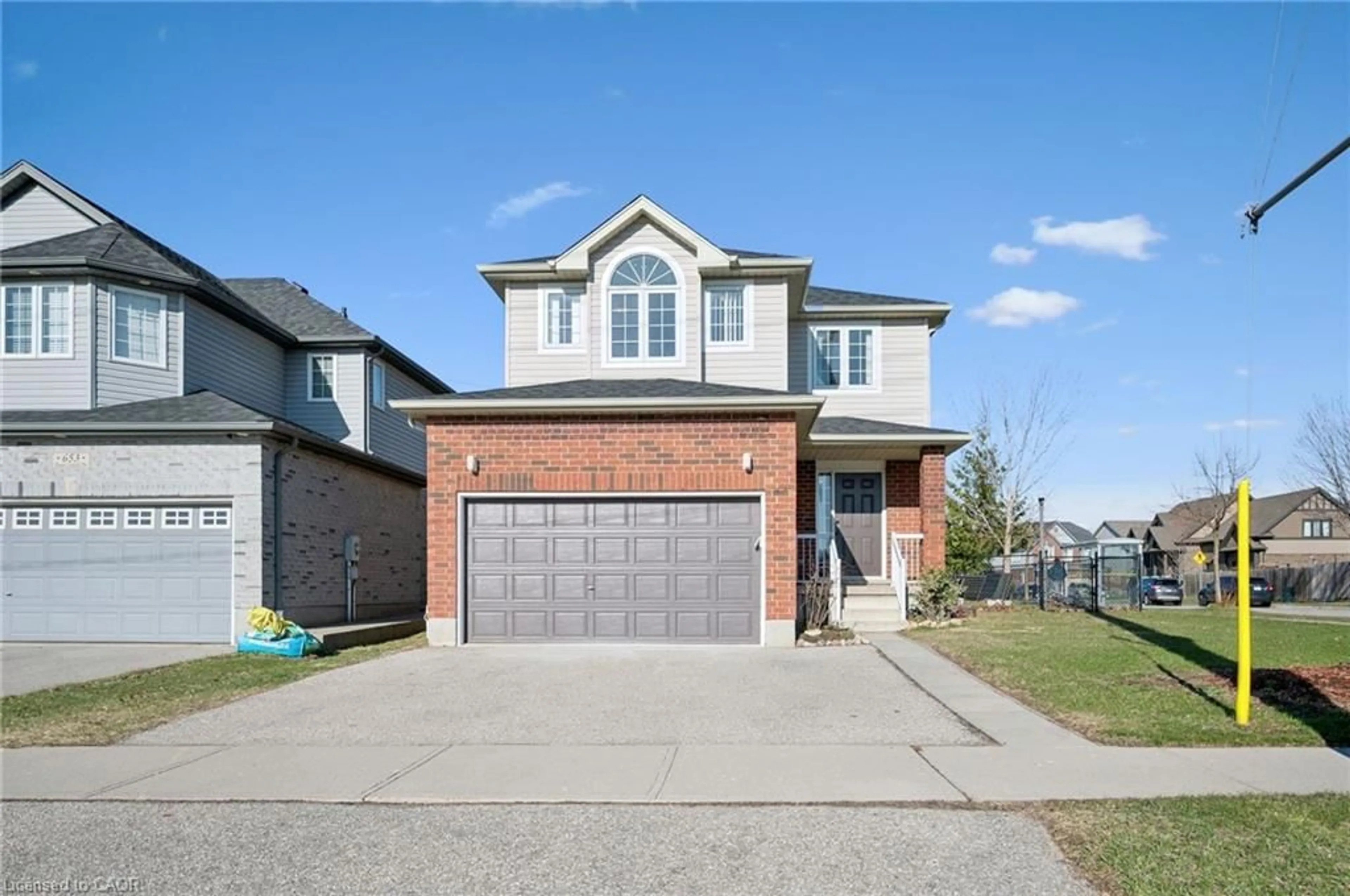 Home with brick exterior material, street for 649 Doon South Dr, Kitchener Ontario N2P 2X5
