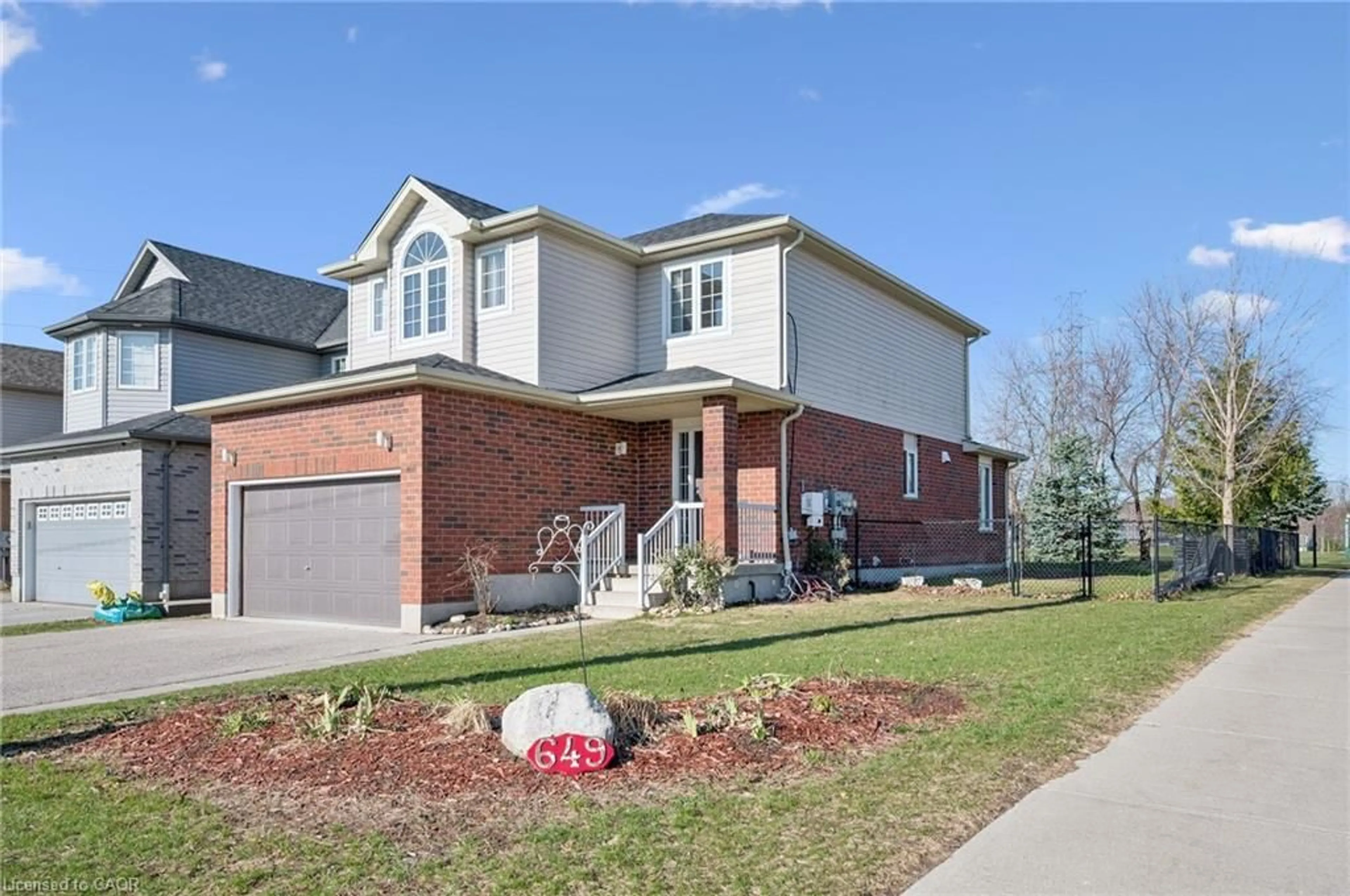 Home with brick exterior material, street for 649 Doon South Dr, Kitchener Ontario N2P 2X5