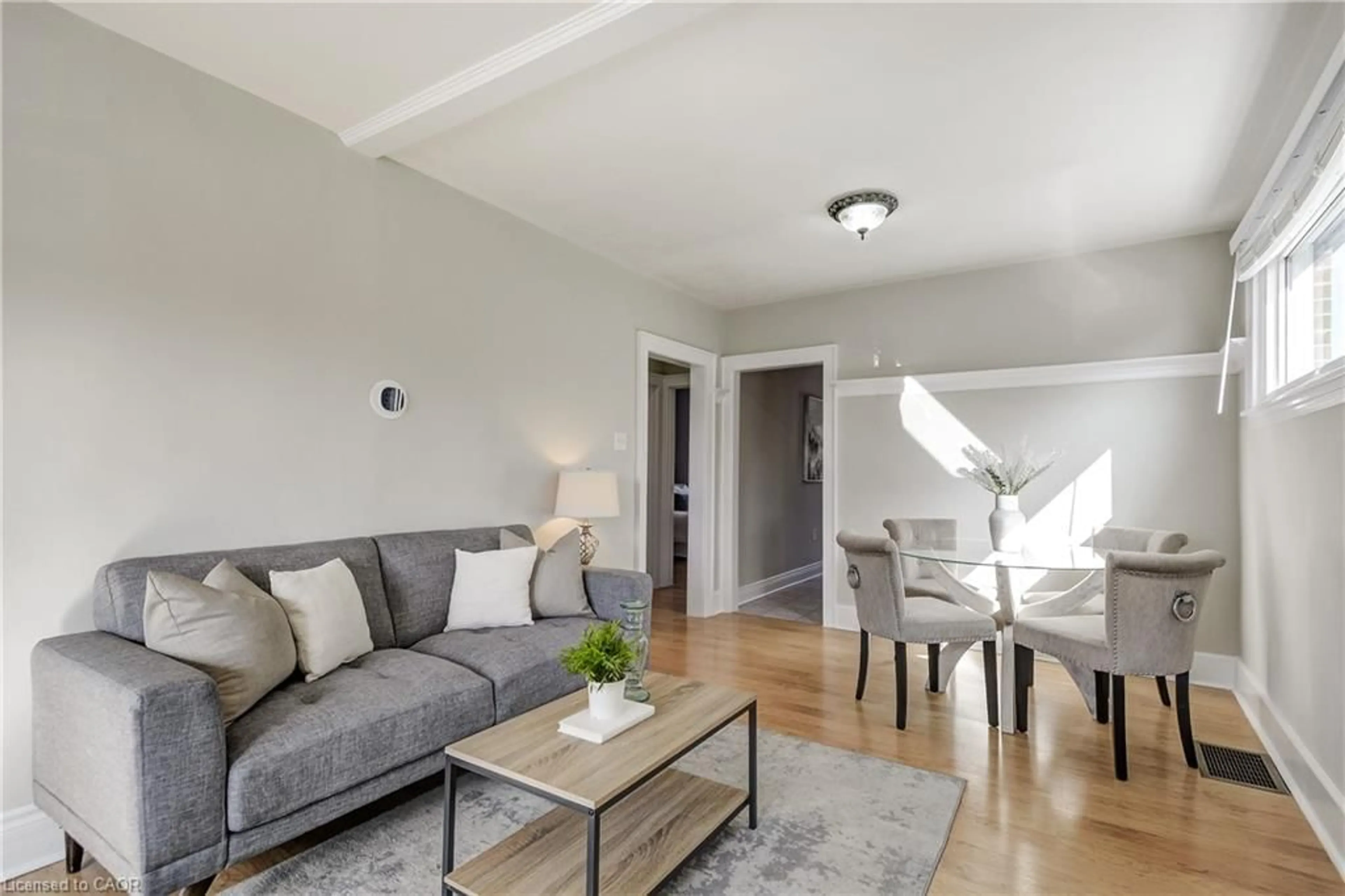 Living room with furniture, wood/laminate floor for 53 East 19th St, Hamilton Ontario L9A 4R9