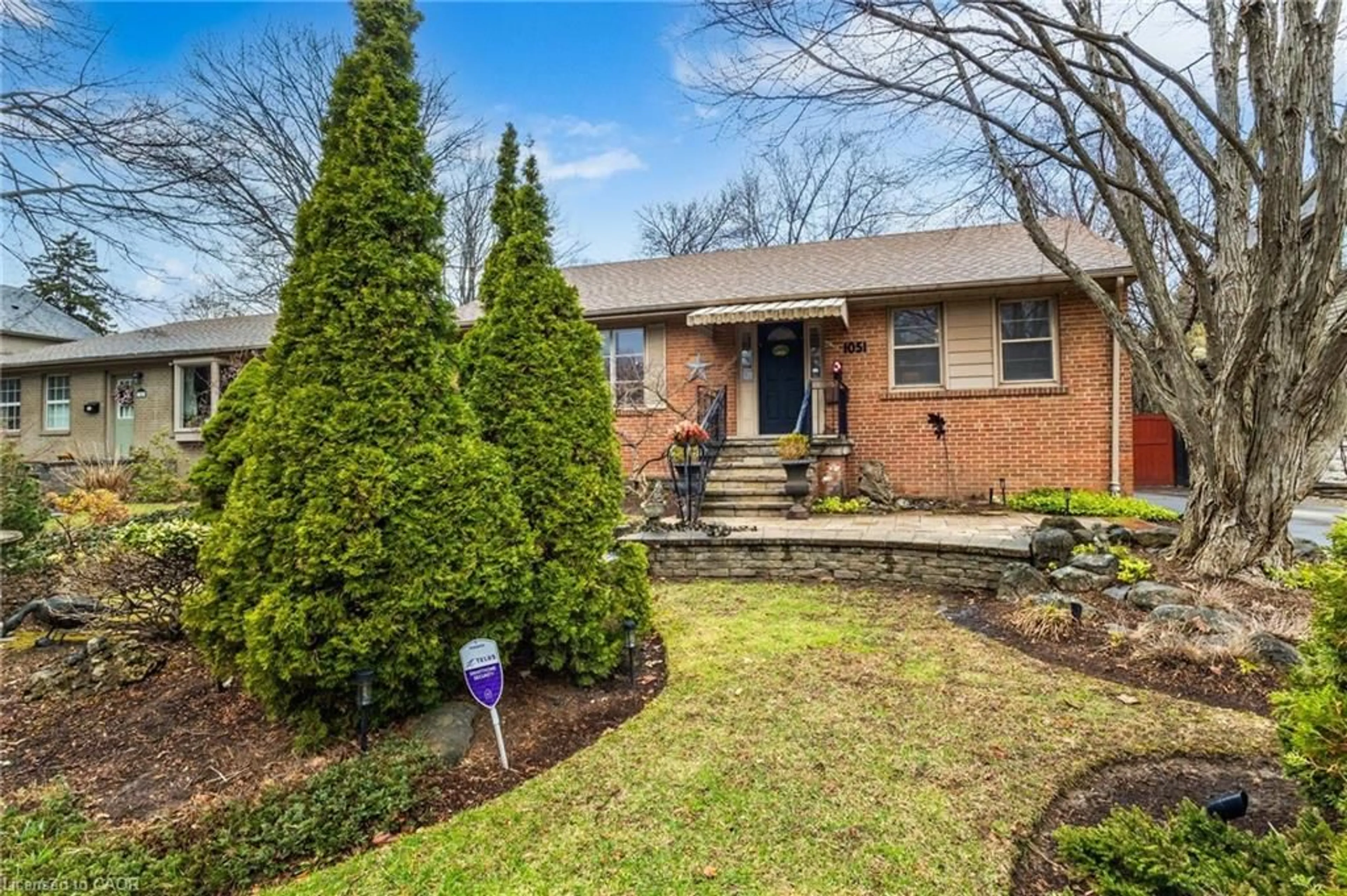 Home with brick exterior material, street for 1051 Melvin Ave, Oakville Ontario L6J 2V8