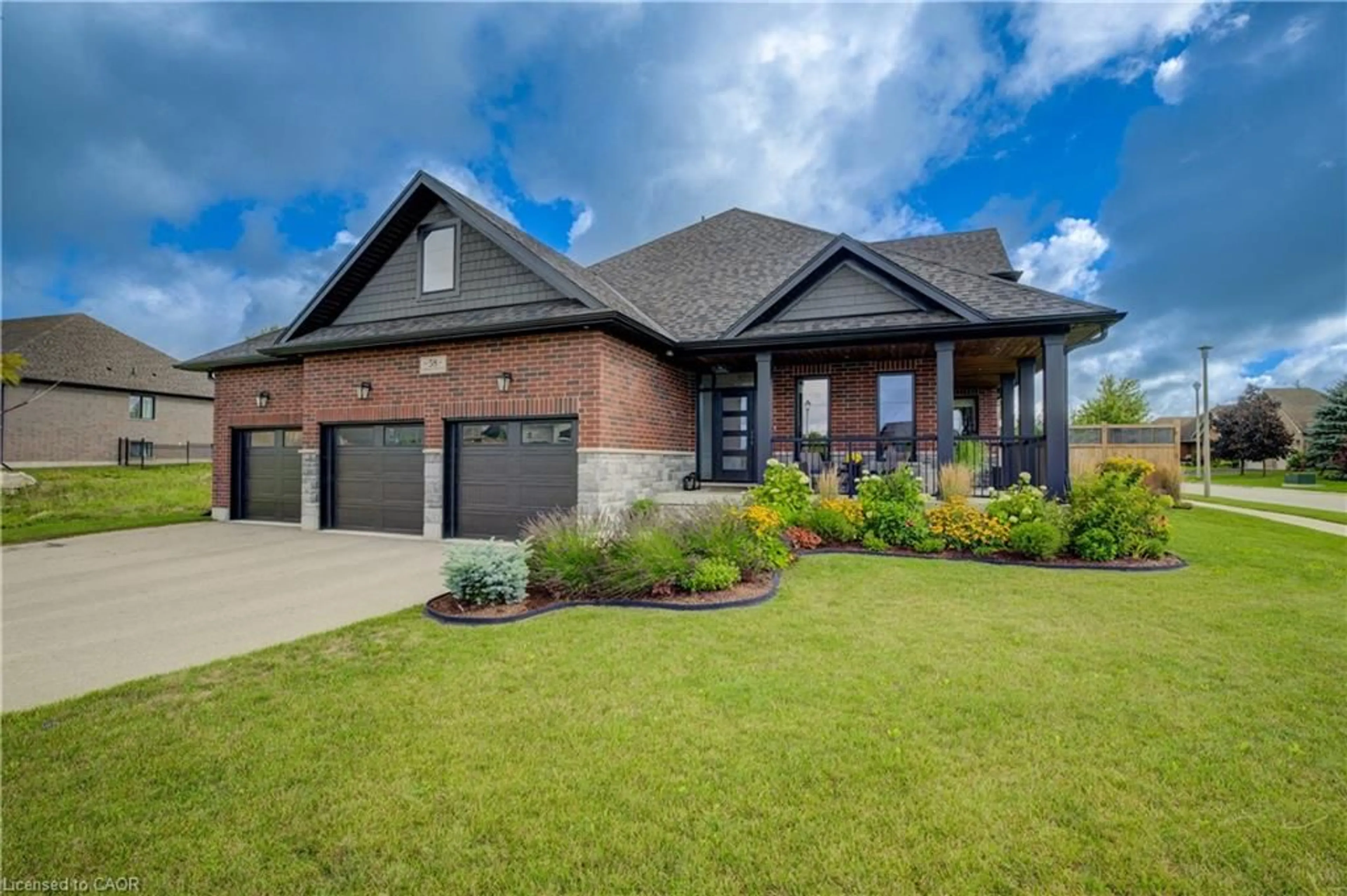 Home with brick exterior material, street for 58 Carriage Cross, Drayton Ontario N0G 1P0
