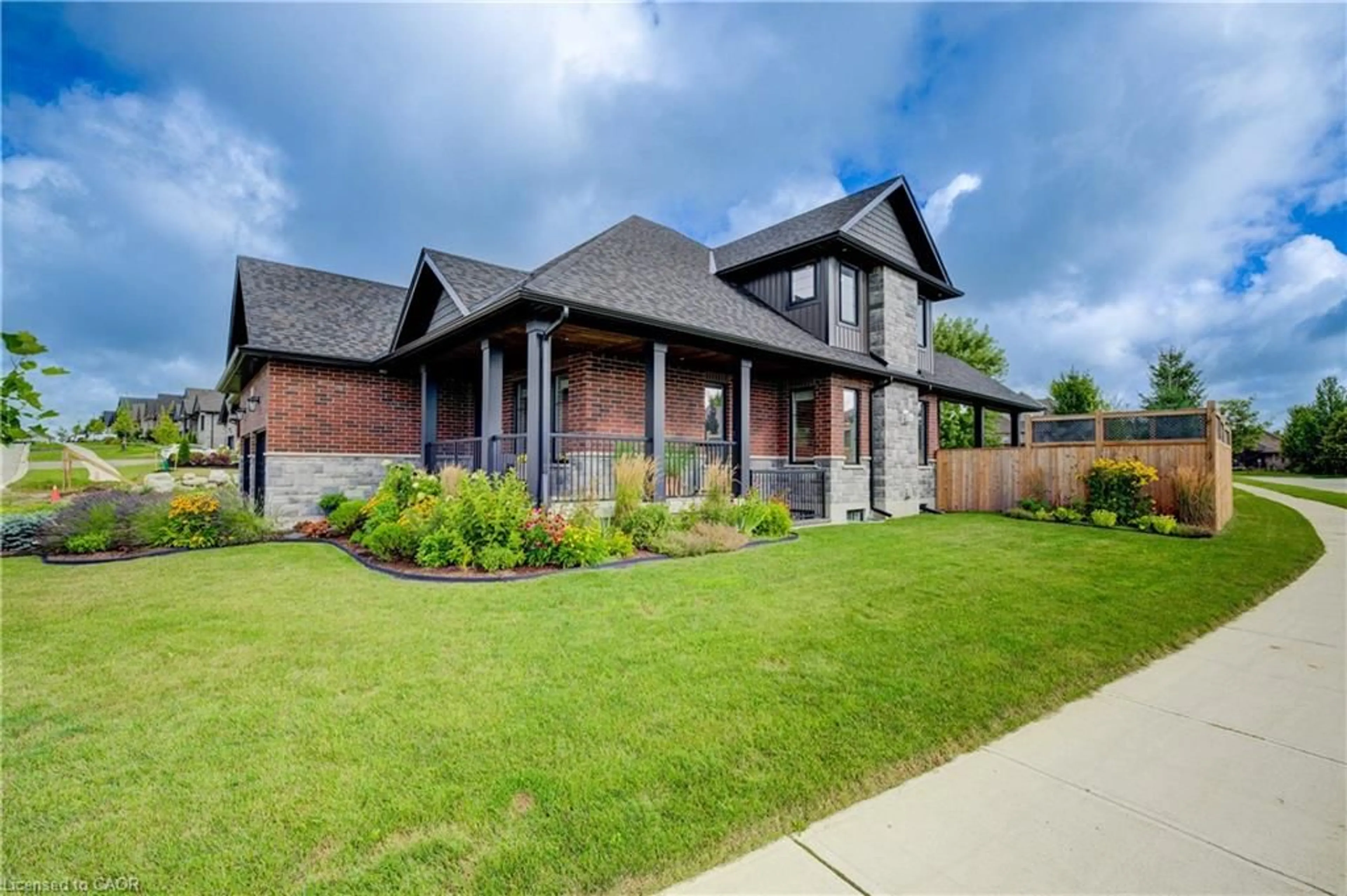 Home with brick exterior material, street for 58 Carriage Cross, Drayton Ontario N0G 1P0