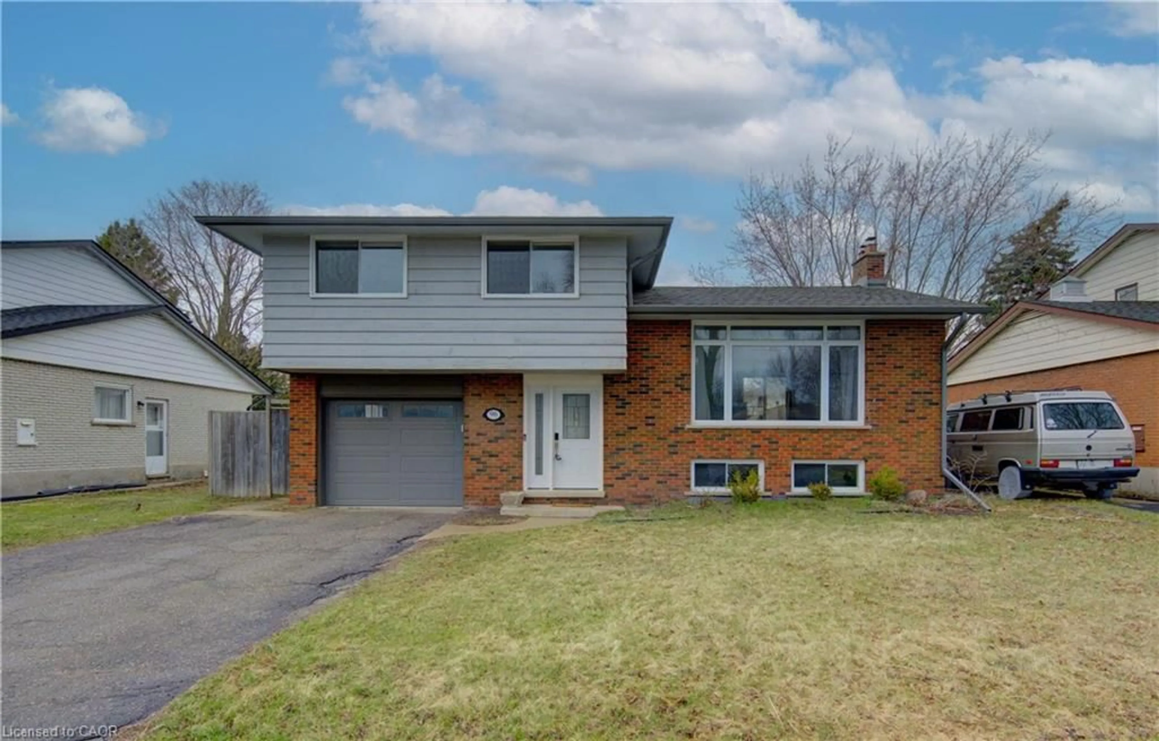 Home with brick exterior material, street for 96 Gibson Dr, Kitchener Ontario N2B 2P4