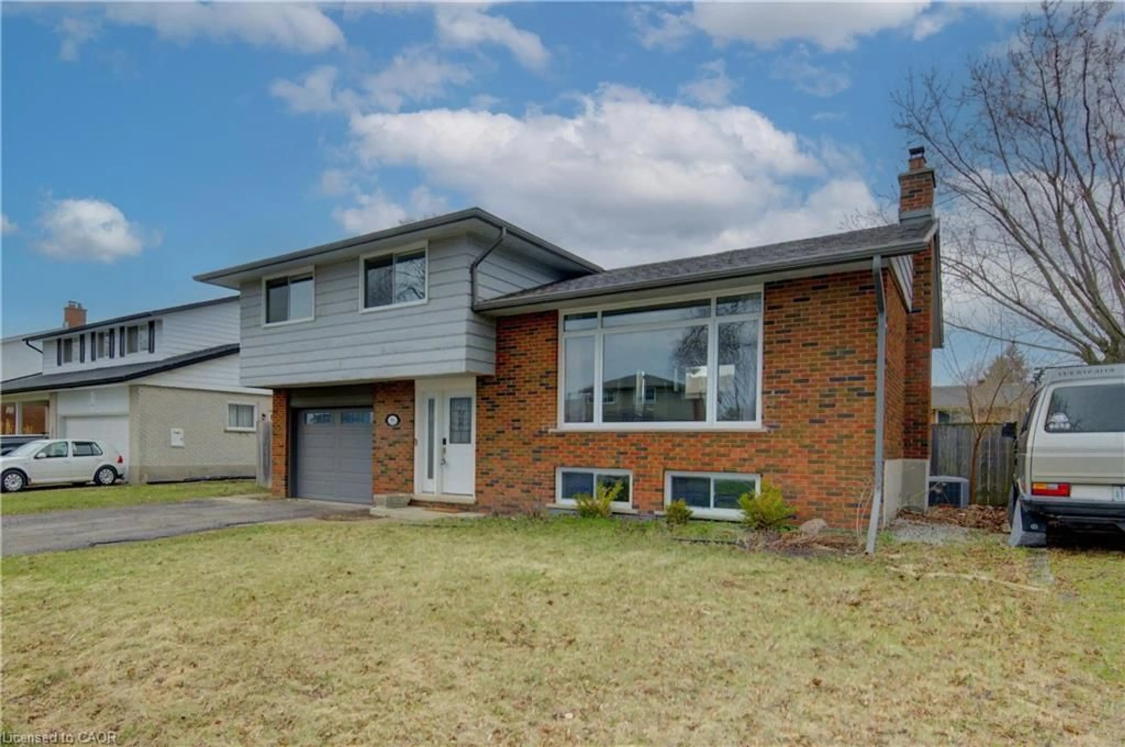 Home with brick exterior material, street for 96 Gibson Dr, Kitchener Ontario N2B 2P4