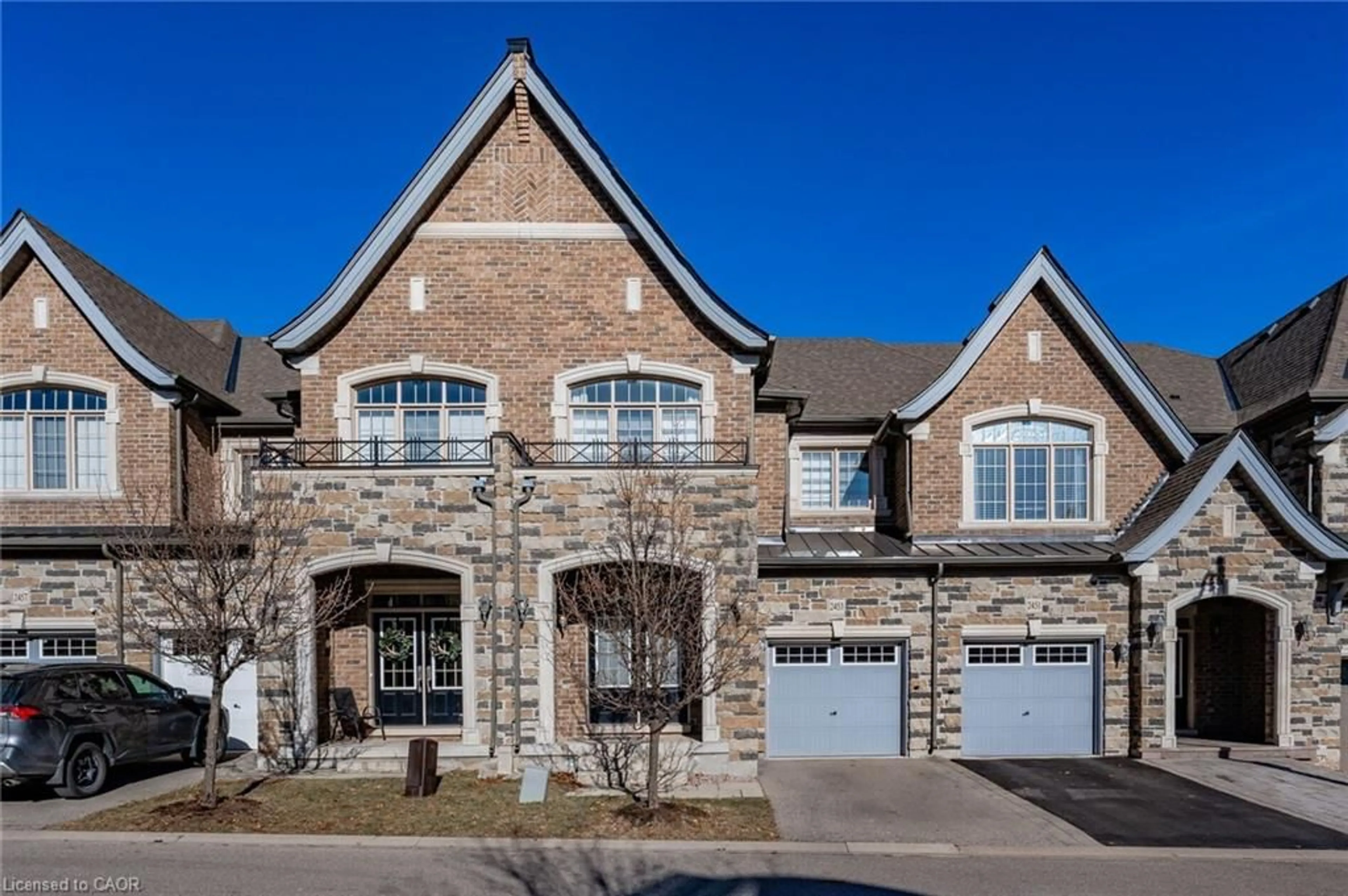 Home with brick exterior material, street for 2453 Village Common, Oakville Ontario L6M 0S2