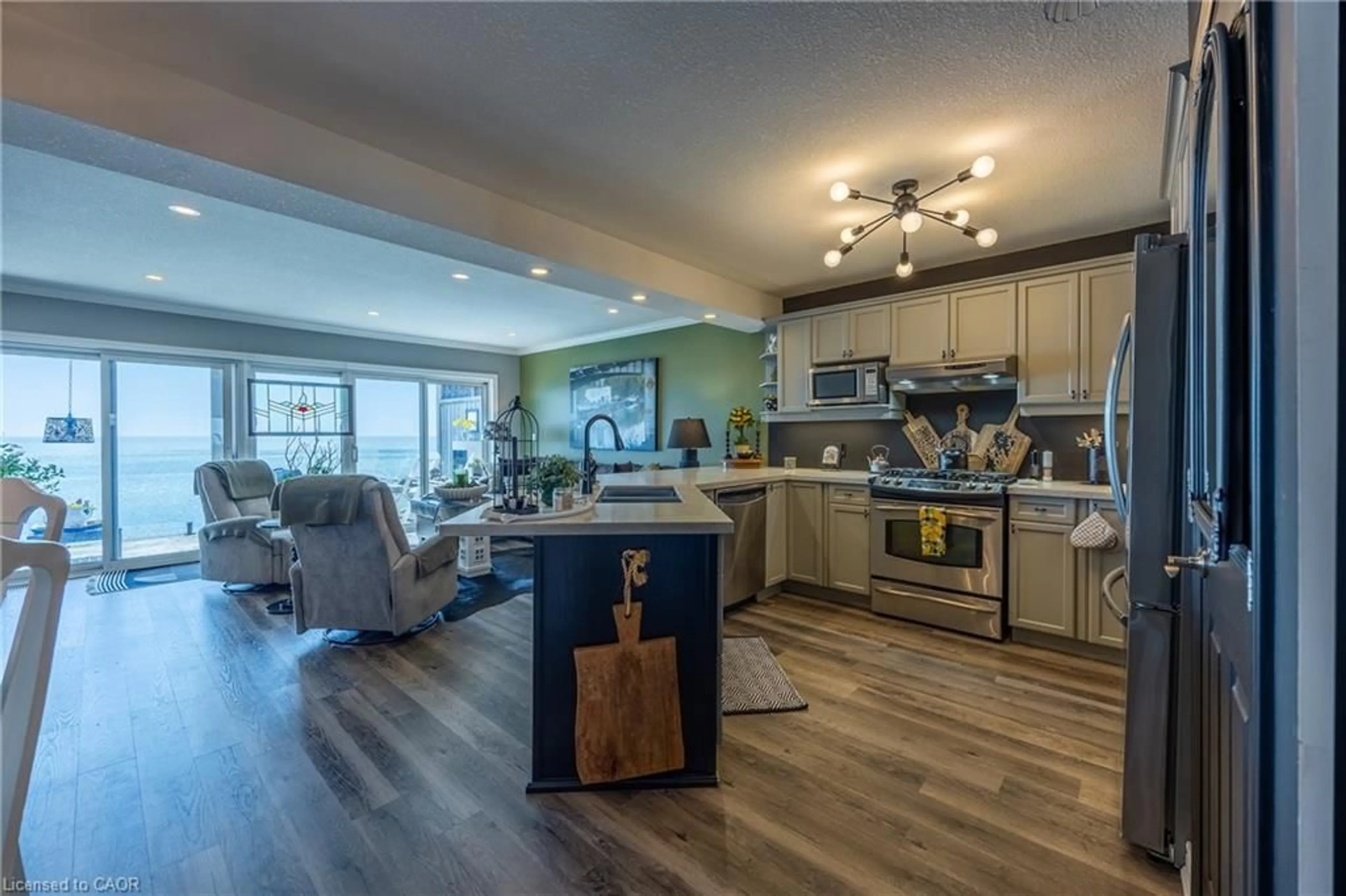 Open concept kitchen, wood/laminate floor for 122 Brown St #2, Port Dover Ontario N0A 1N7