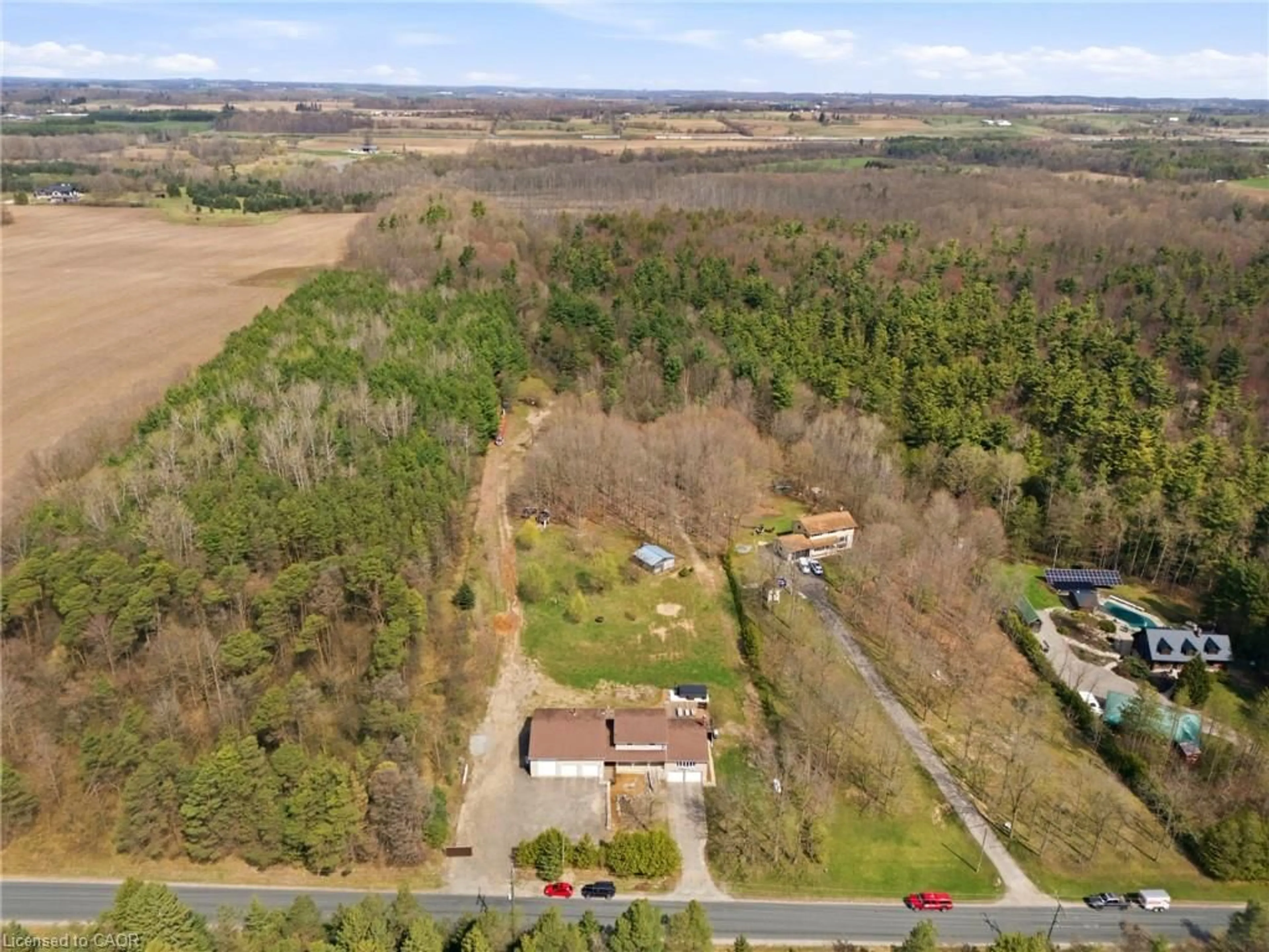 A pic from outside/outdoor area/front of a property/back of a property/a pic from drone, forest/trees view for 827511 Township 8 Rd, Drumbo Ontario N0J 1G0