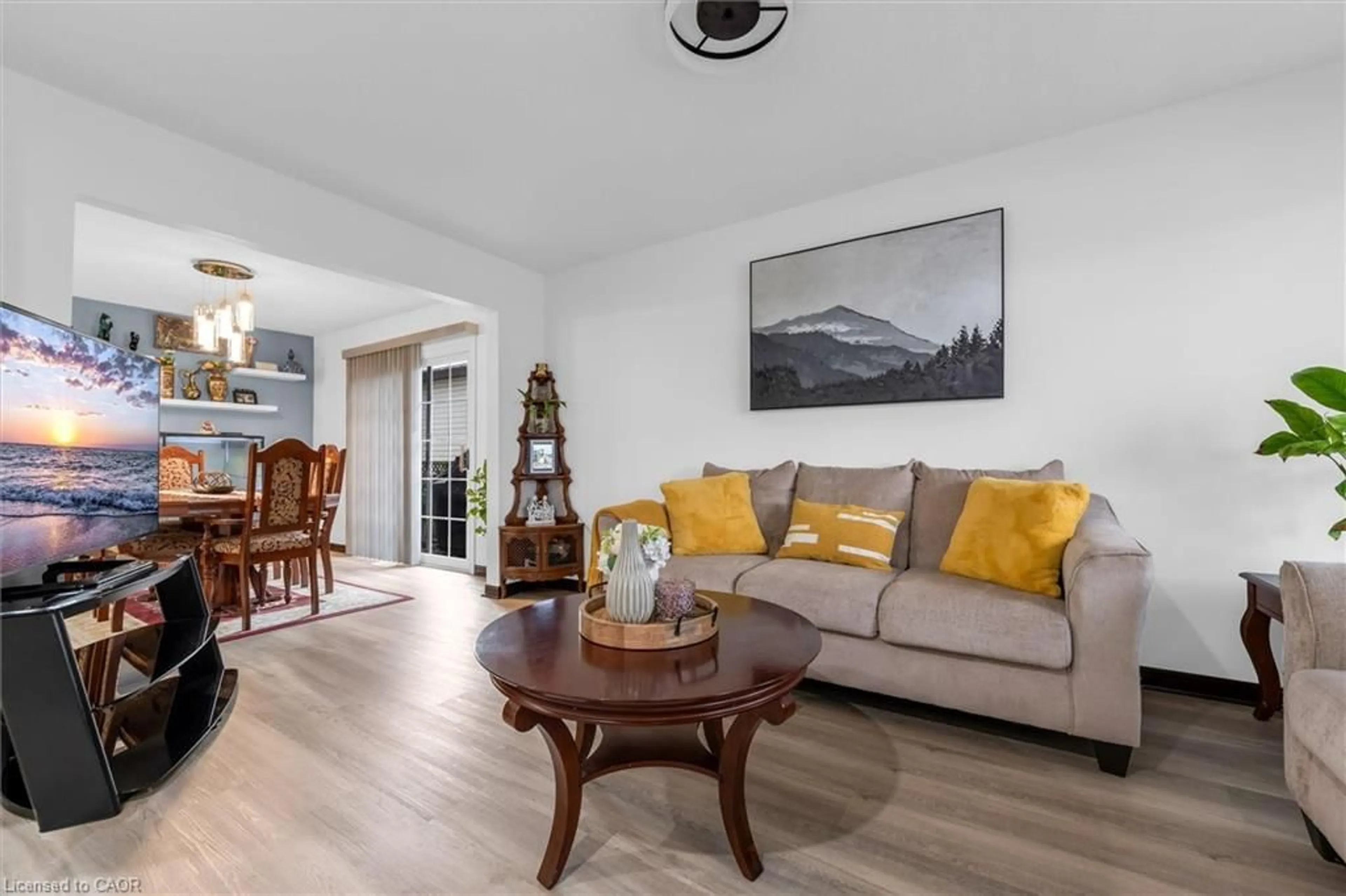 Living room with furniture, wood/laminate floor for 51 Independence Dr, Hamilton Ontario L8W 3C3