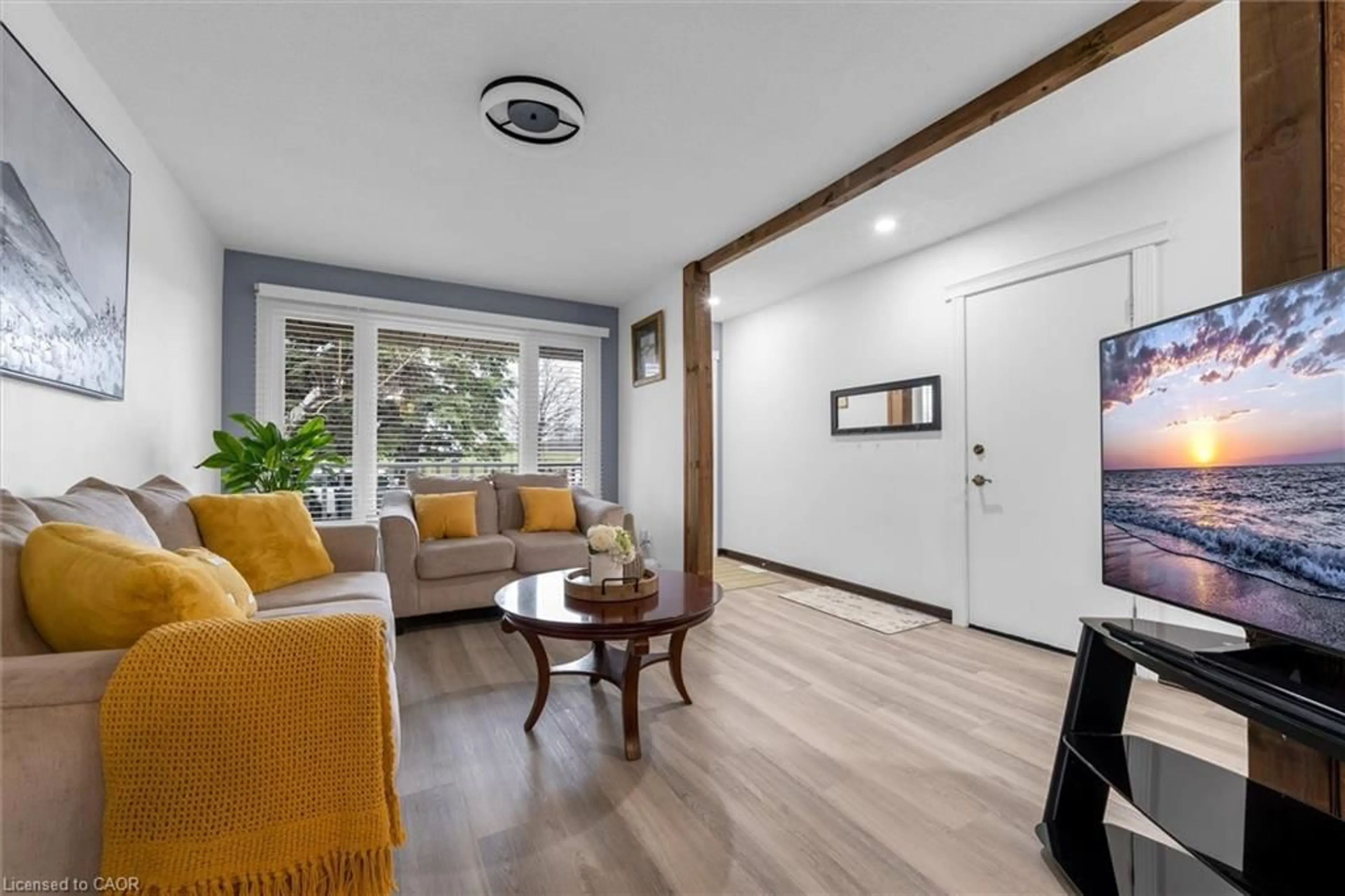 Living room with furniture, wood/laminate floor for 51 Independence Dr, Hamilton Ontario L8W 3C3