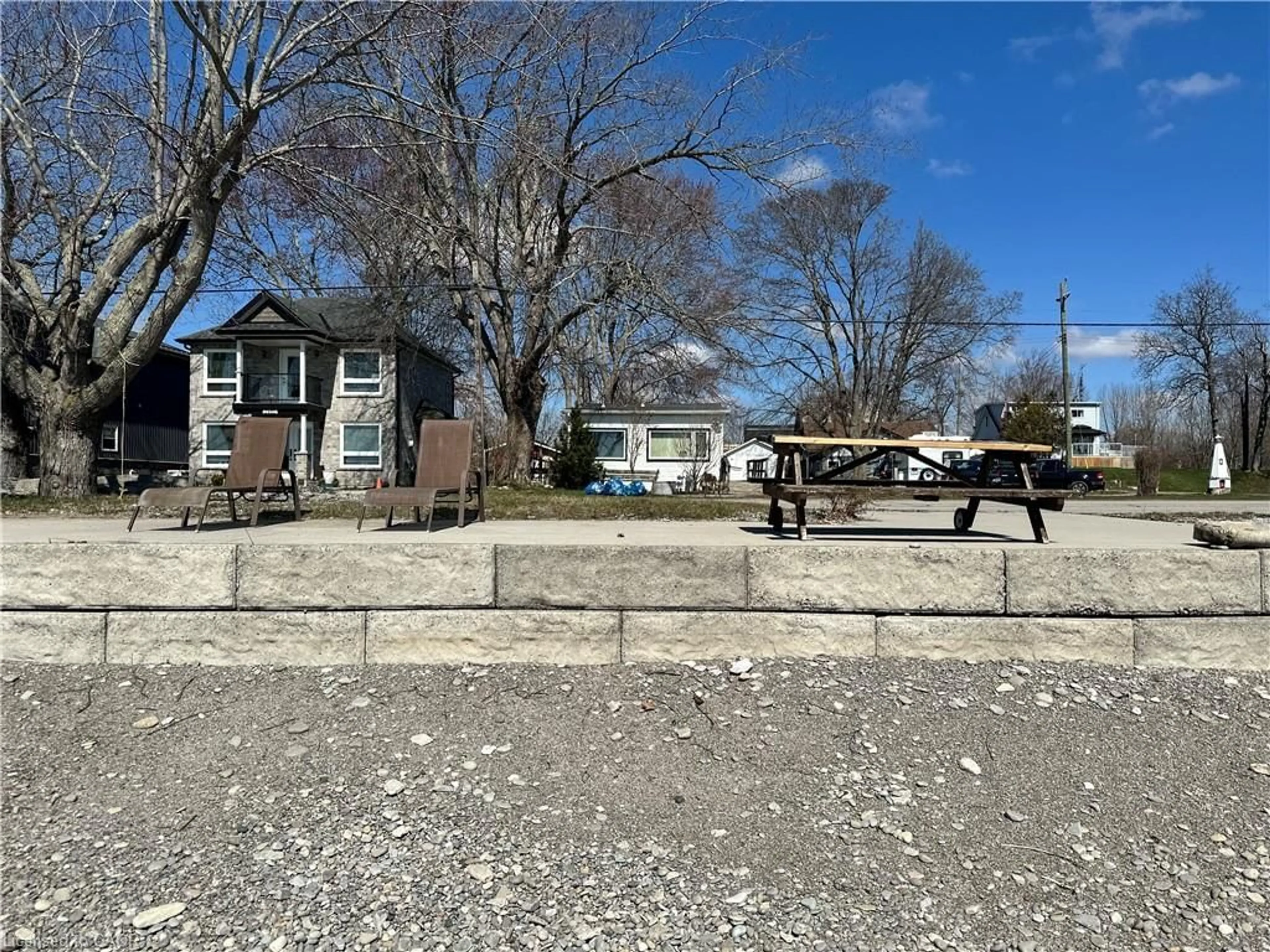 A pic from outside/outdoor area/front of a property/back of a property/a pic from drone, street for 2483 North Shore Dr, Lowbanks Ontario N0A 1K0