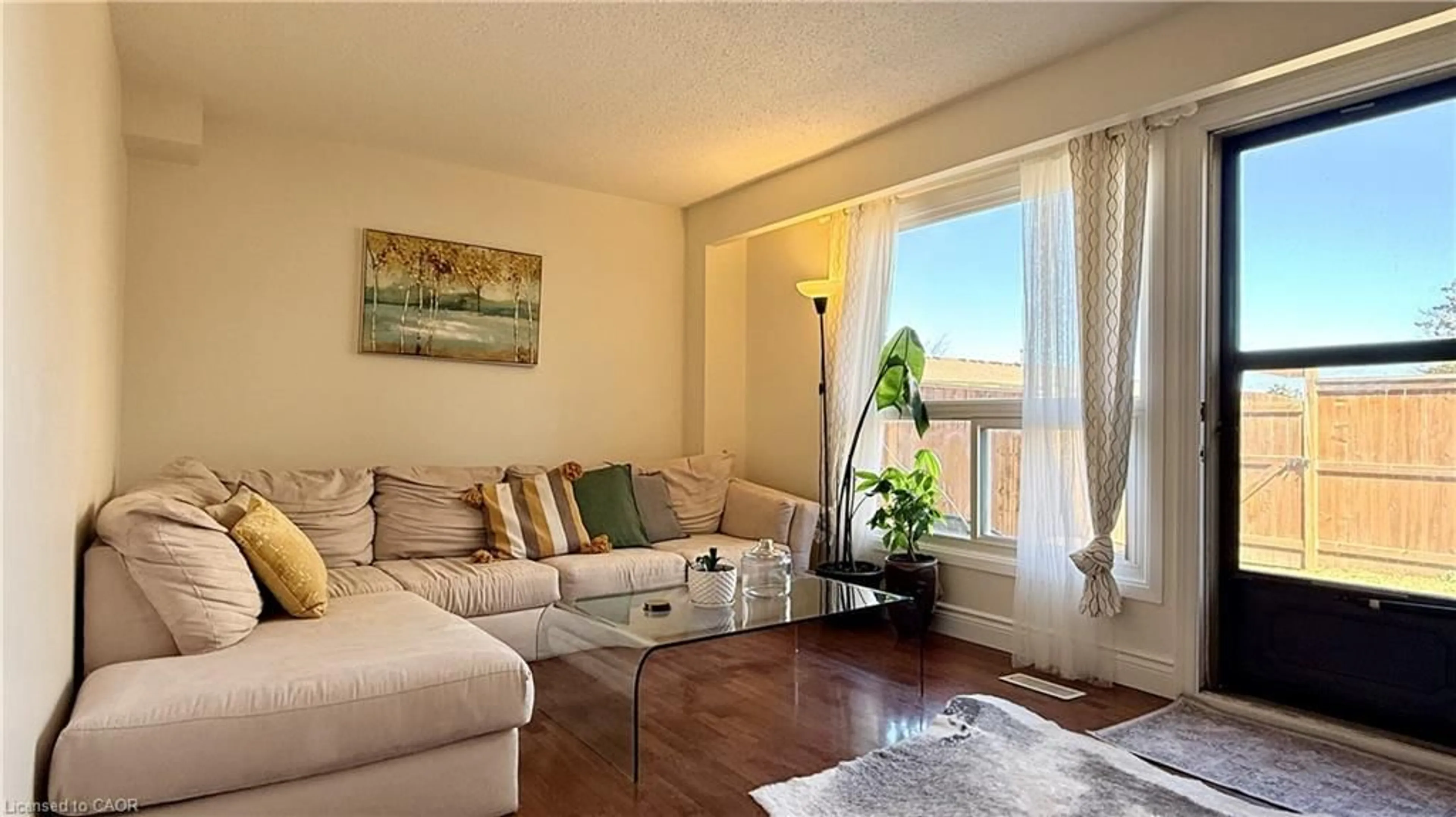 Living room with furniture, wood/laminate floor for 223 Pioneer Dr #F39, Kitchener Ontario N2P 1L9