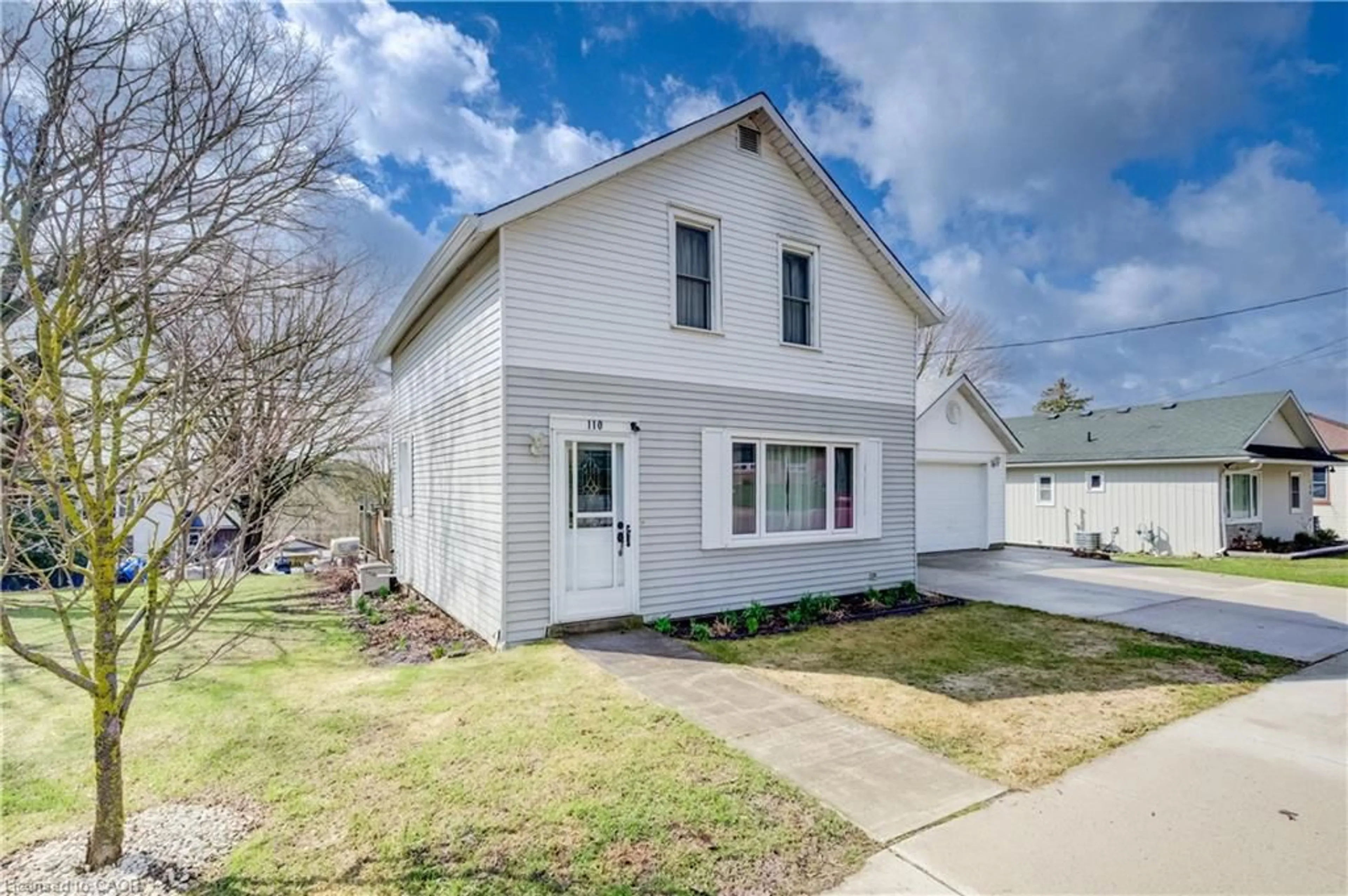 Home with vinyl exterior material, street for 110 Miller St, Mount Forest Ontario N0G 2L3