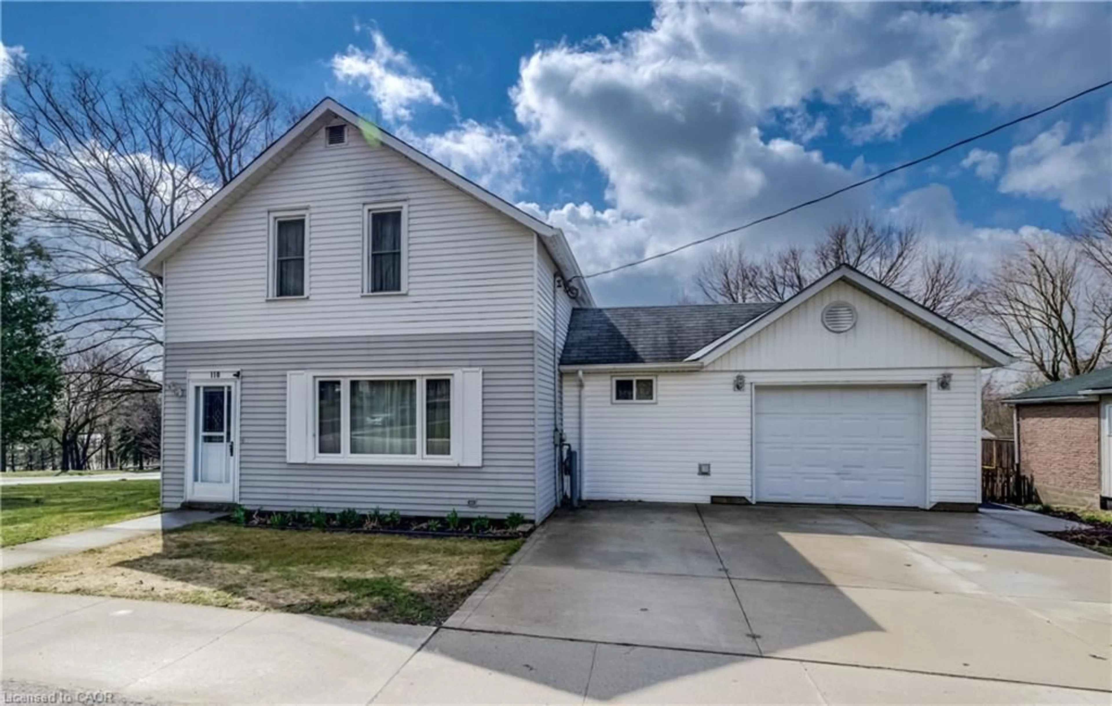 Home with vinyl exterior material, street for 110 Miller St, Mount Forest Ontario N0G 2L3