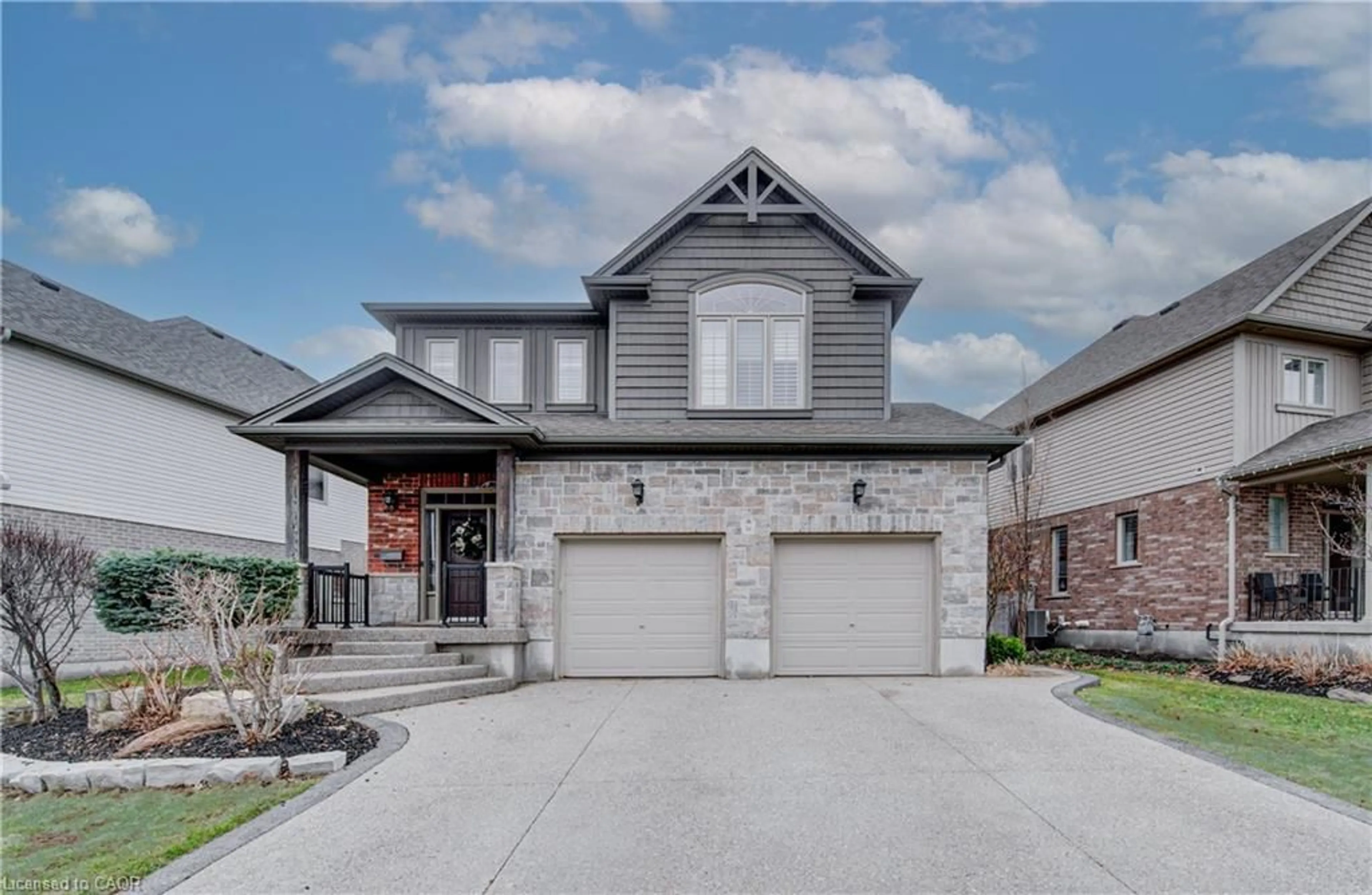 Home with brick exterior material, street for 58 Eden Oak Trail, Kitchener Ontario N2A 0G3