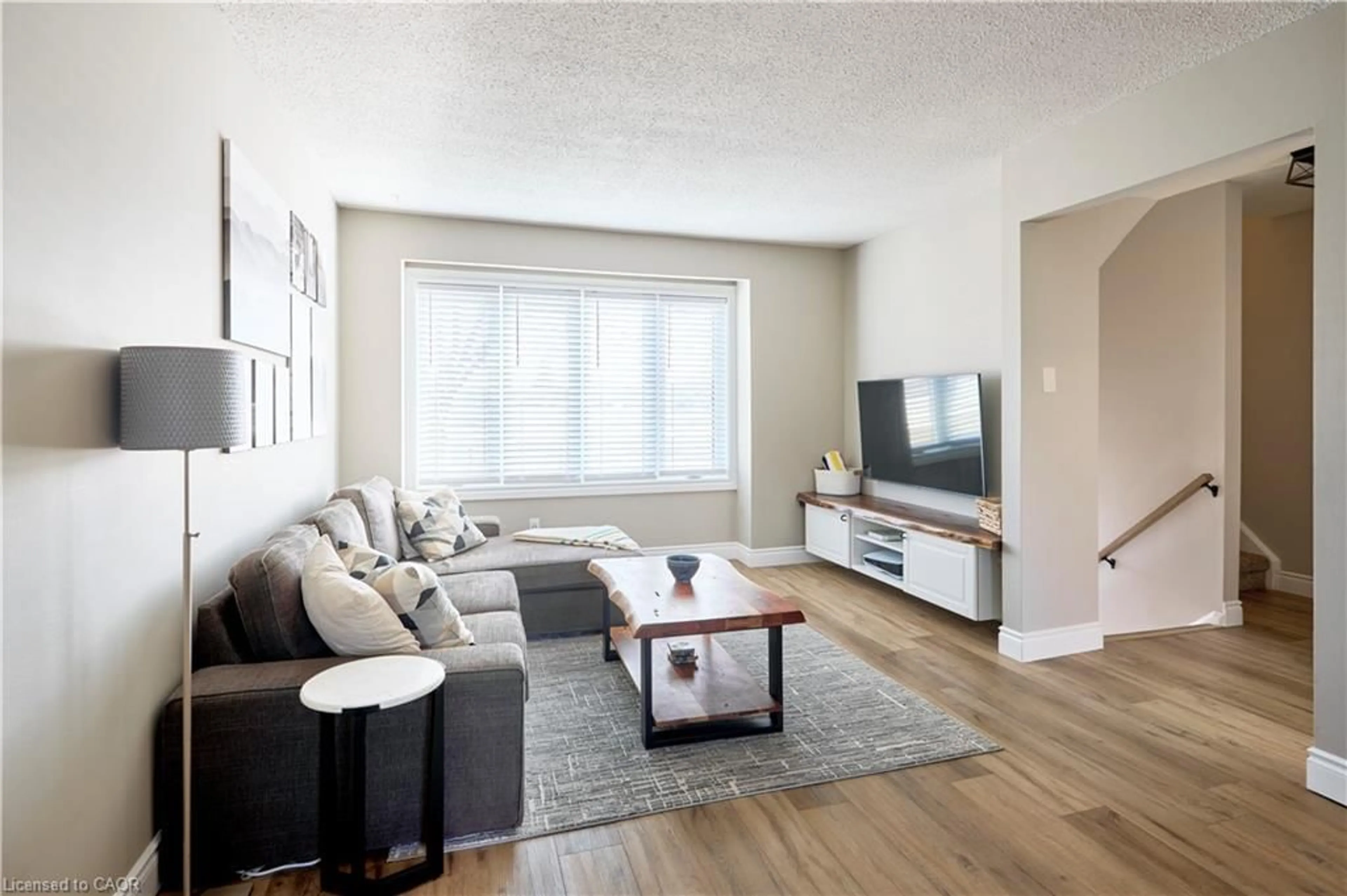 Living room with furniture, wood/laminate floor for 46 Cedarwoods Cres #27, Kitchener Ontario N2C 2L7