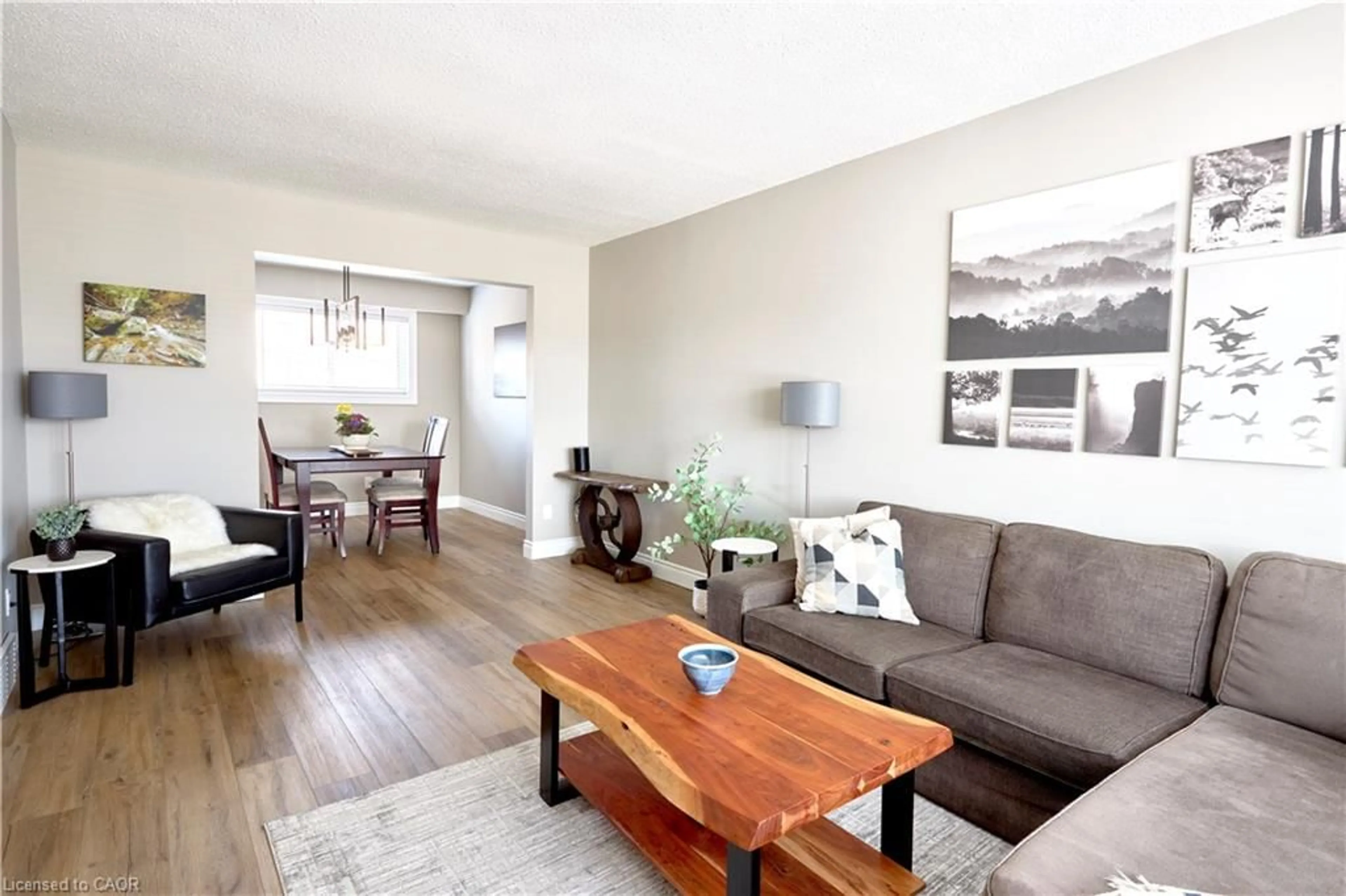 Living room with furniture, wood/laminate floor for 46 Cedarwoods Cres #27, Kitchener Ontario N2C 2L7
