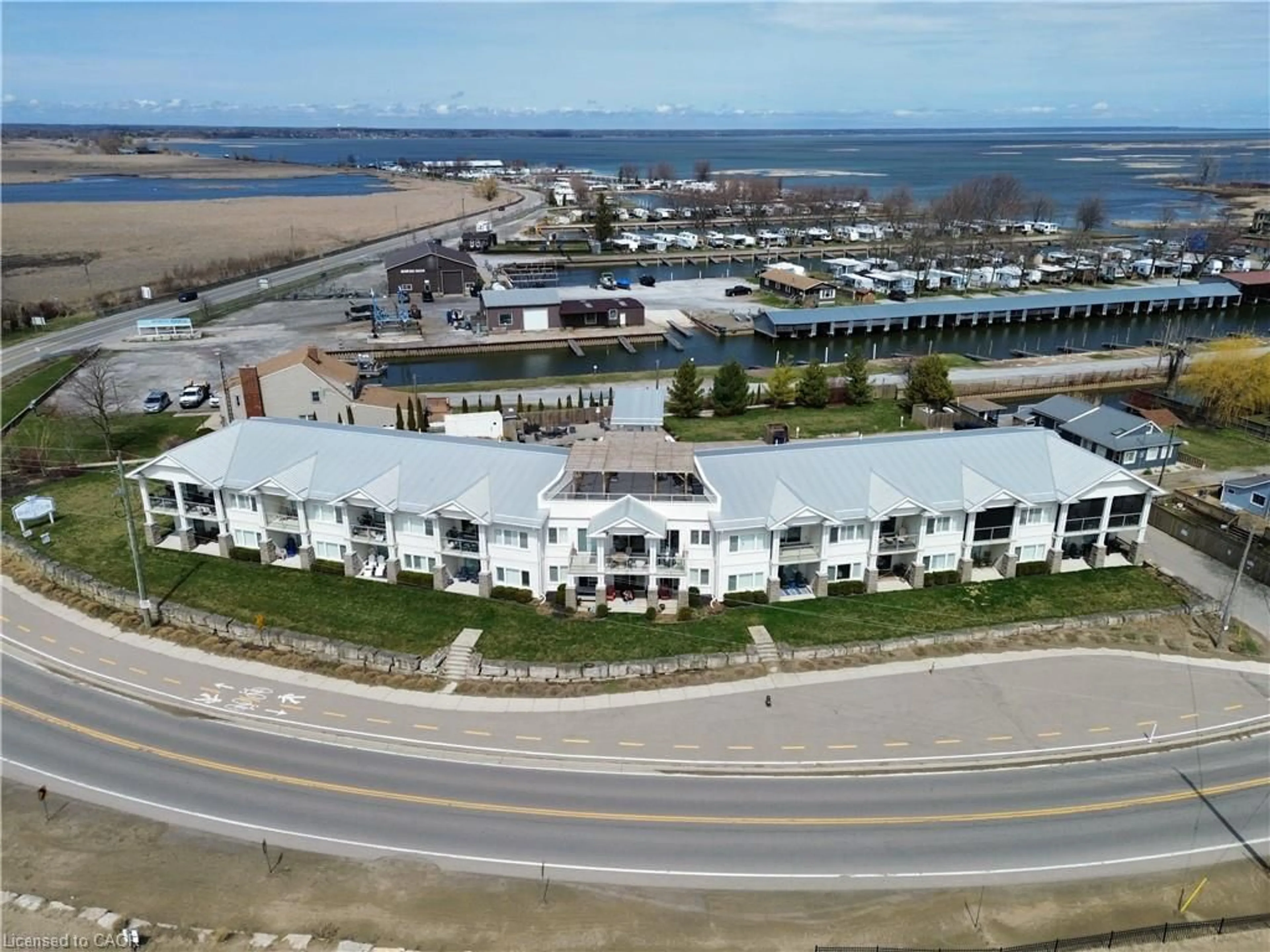 A pic from outside/outdoor area/front of a property/back of a property/a pic from drone, water/lake/river/ocean view for 12 Erie Blvd #207, Long Point Ontario N0E 1M0