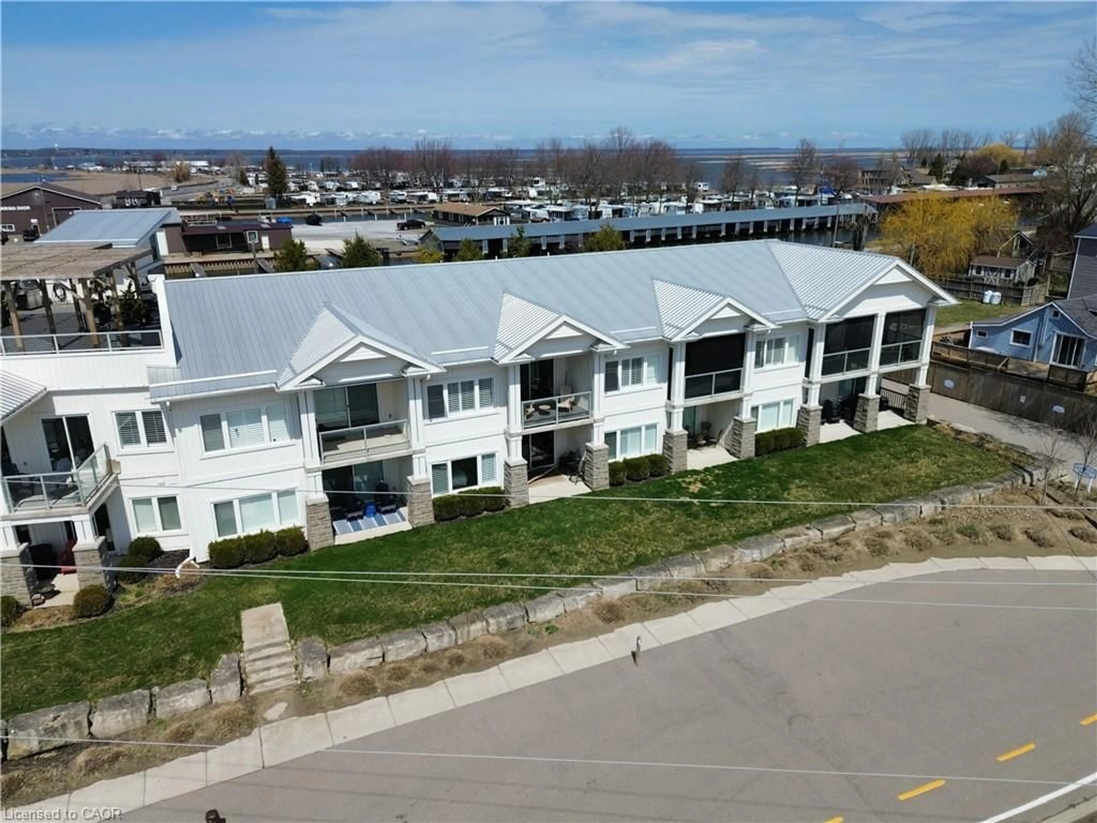 A pic from outside/outdoor area/front of a property/back of a property/a pic from drone, water/lake/river/ocean view for 12 Erie Blvd #207, Long Point Ontario N0E 1M0