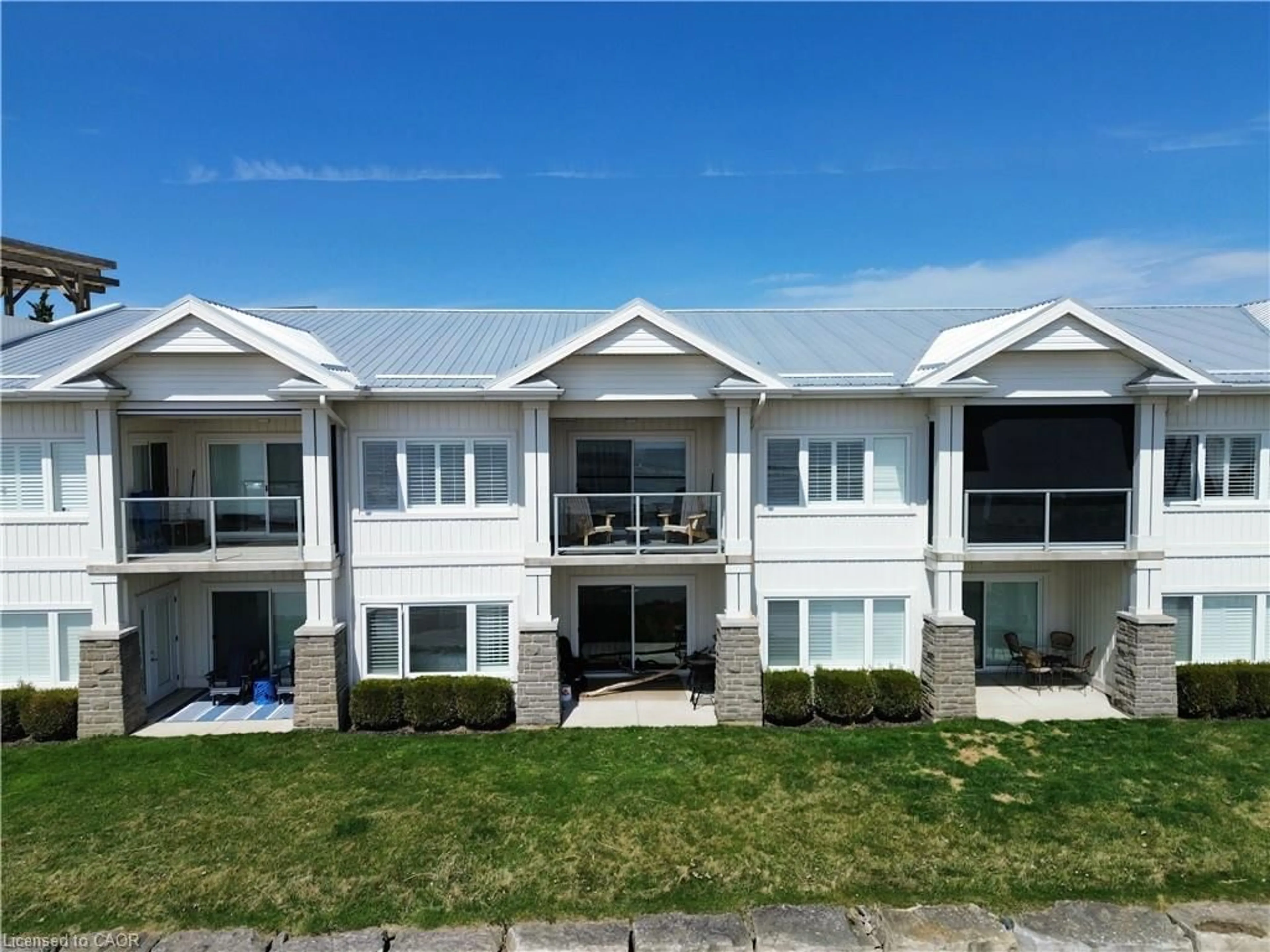 A pic from outside/outdoor area/front of a property/back of a property/a pic from drone, water/lake/river/ocean view for 12 Erie Blvd #207, Long Point Ontario N0E 1M0