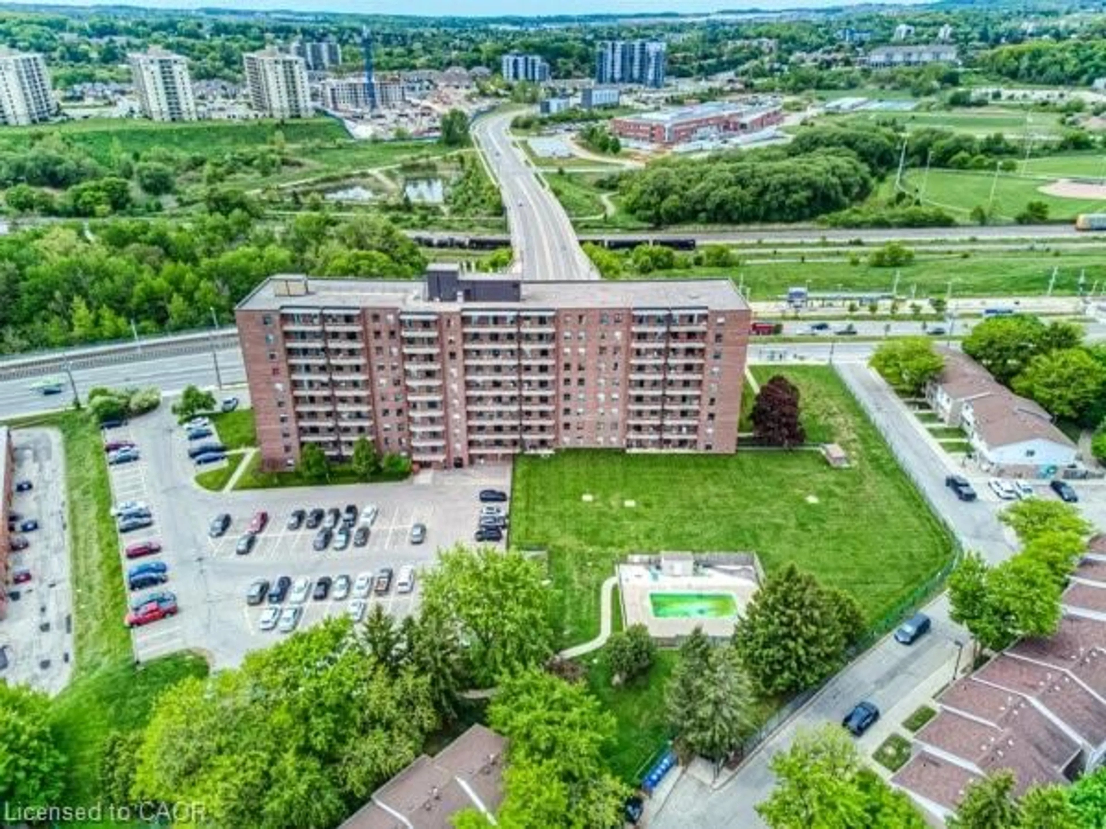 A pic from outside/outdoor area/front of a property/back of a property/a pic from drone, city buildings view from balcony for 1100 Courtland Ave #404, Kitchener Ontario N2C 2H9