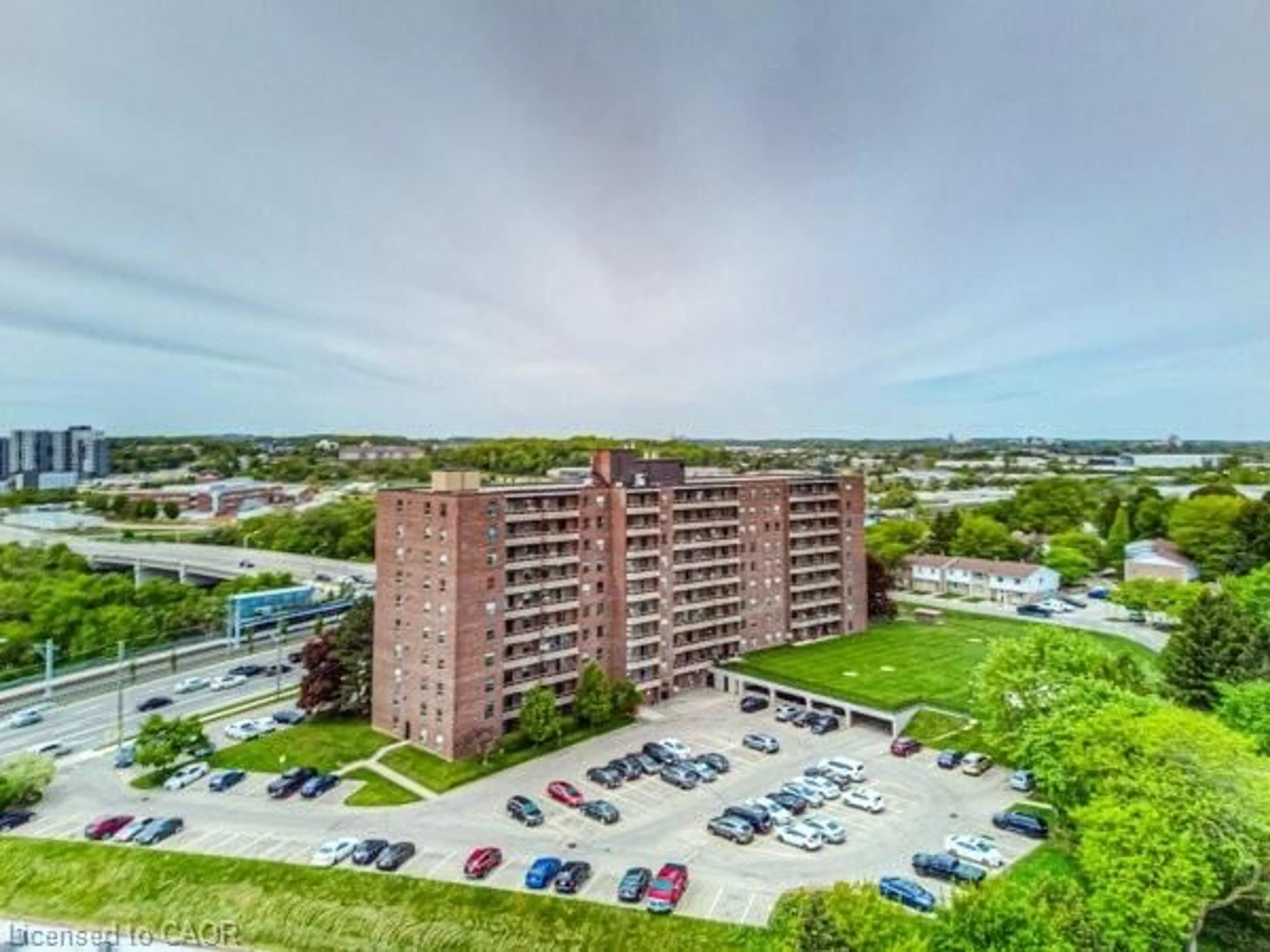 A pic from outside/outdoor area/front of a property/back of a property/a pic from drone, building for 1100 Courtland Ave #404, Kitchener Ontario N2C 2H9