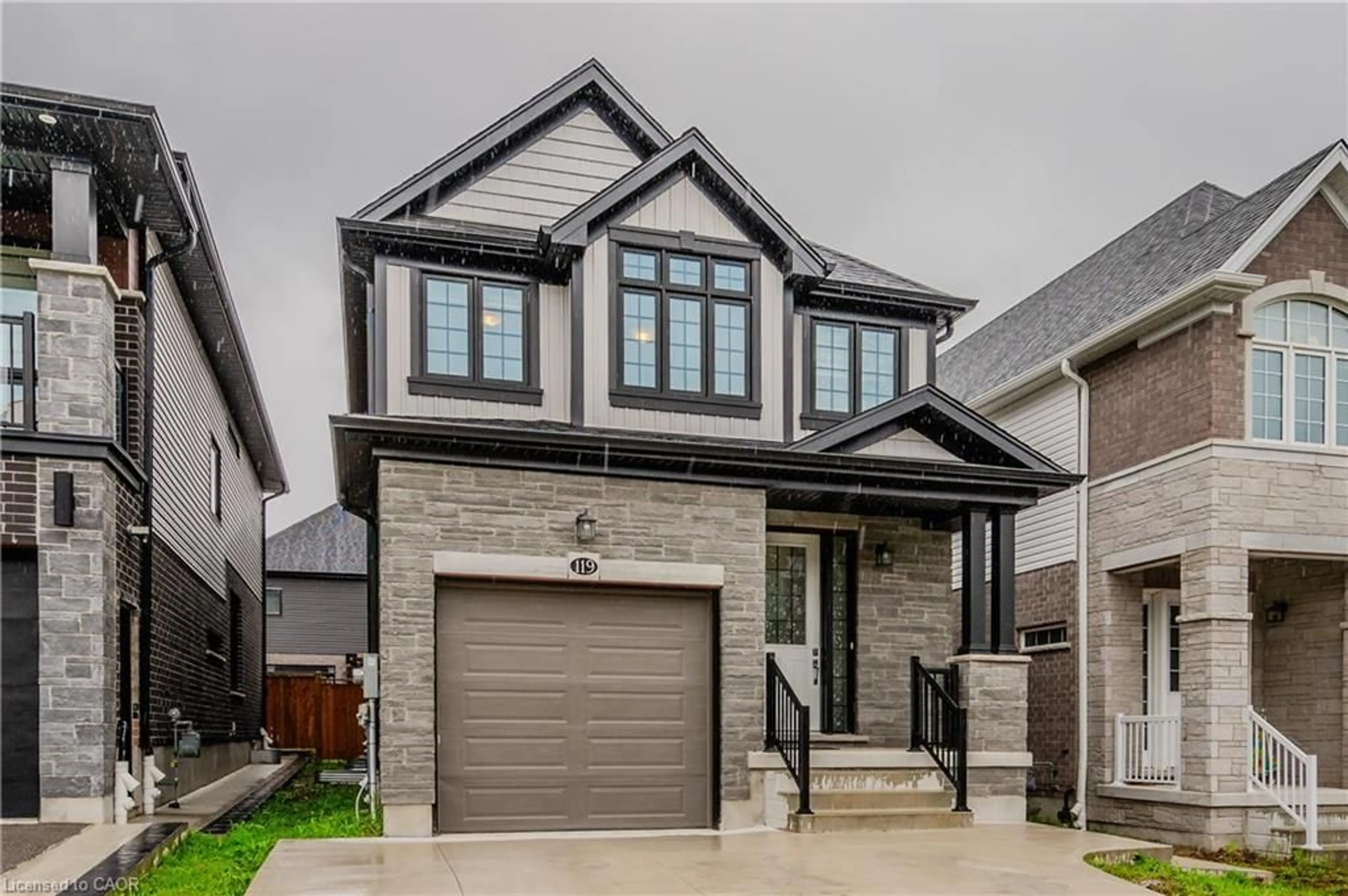 Home with brick exterior material, street for 119 Monarch Woods Dr, Kitchener Ontario N2P 0K2