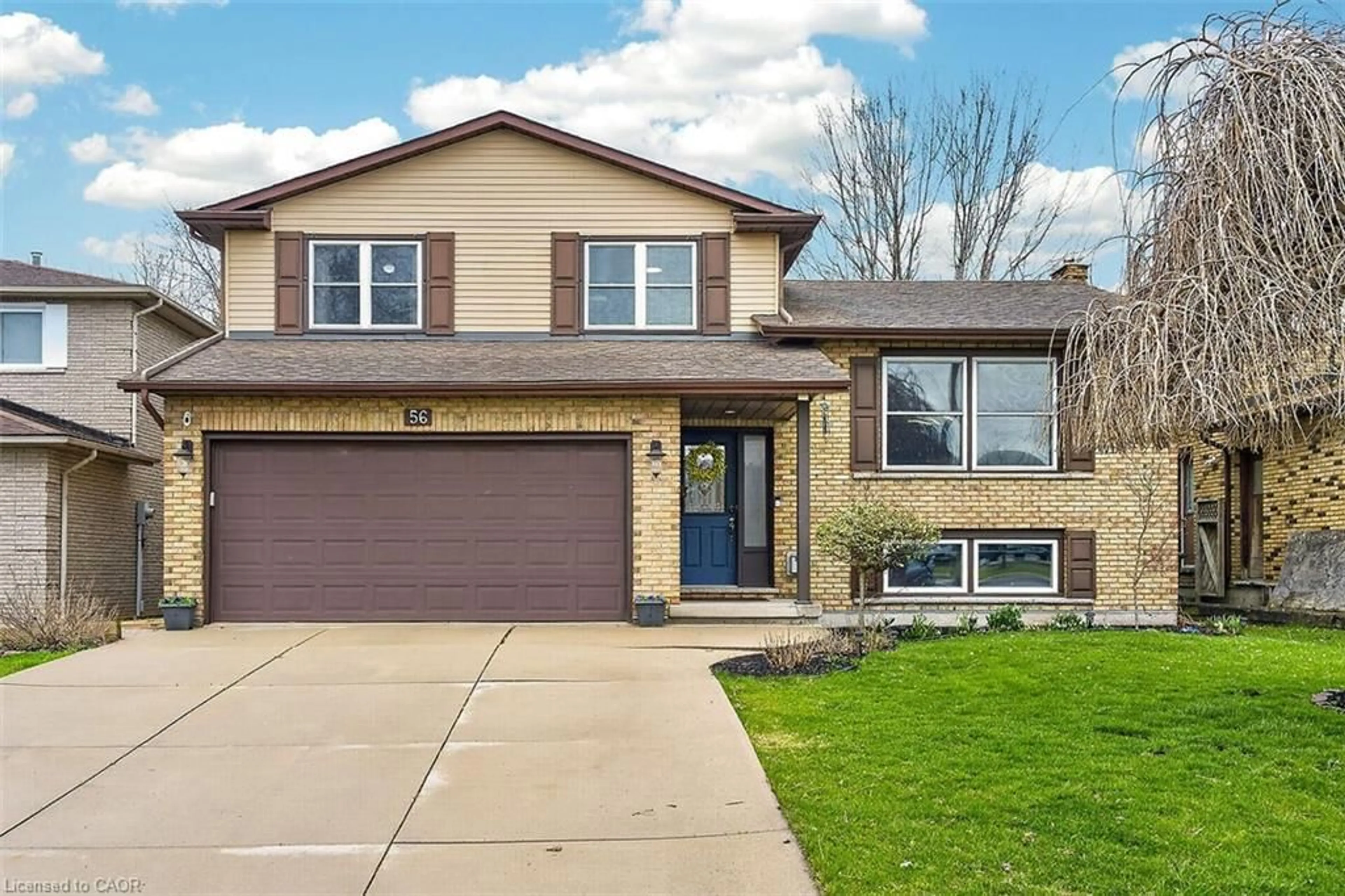 Home with vinyl exterior material, street for 56 Hummingbird Lane, Hamilton Ontario L9A 4A9