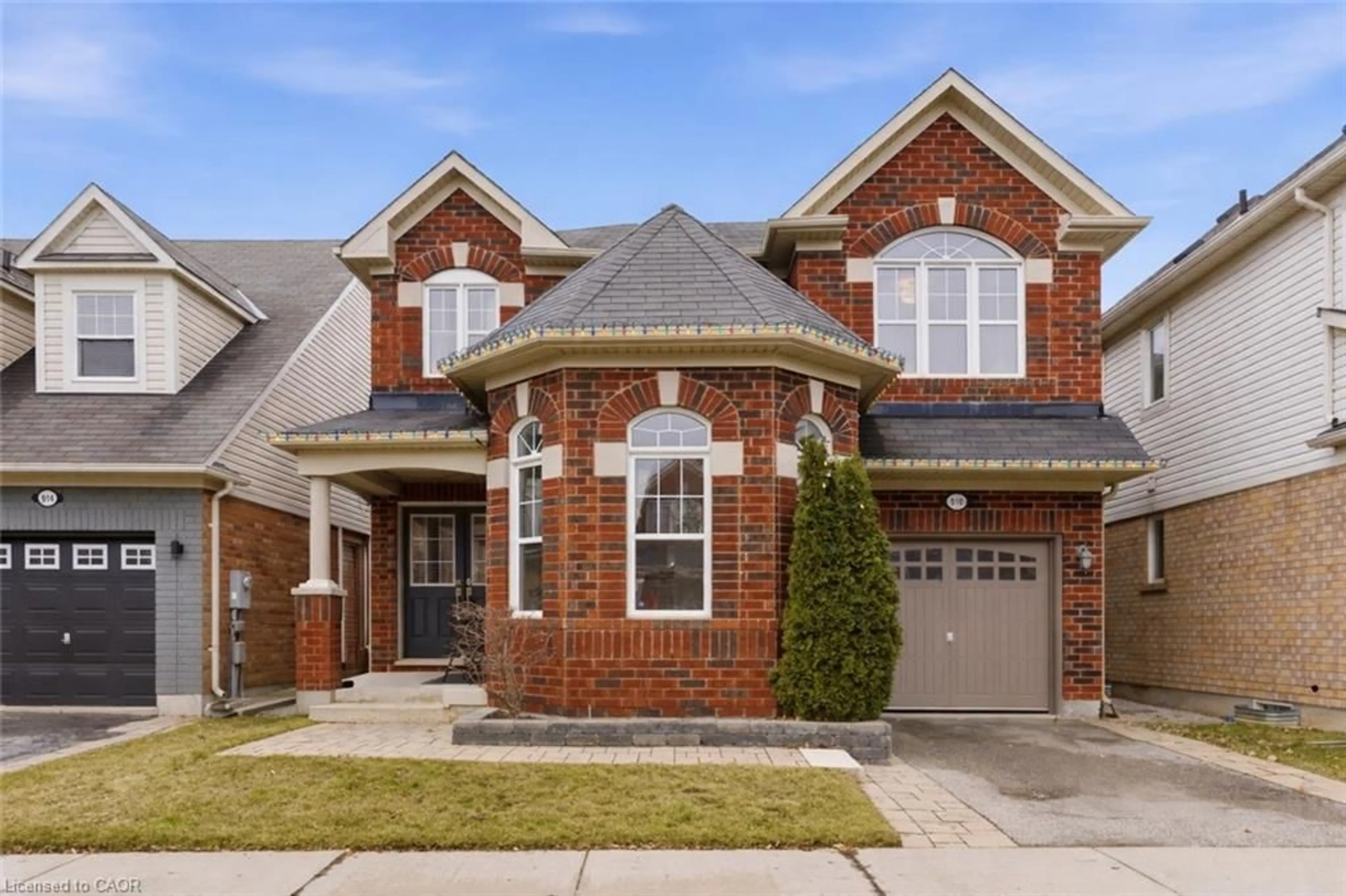 Home with brick exterior material, street for 910 Vickerman Way, Milton Ontario L9T 0K5