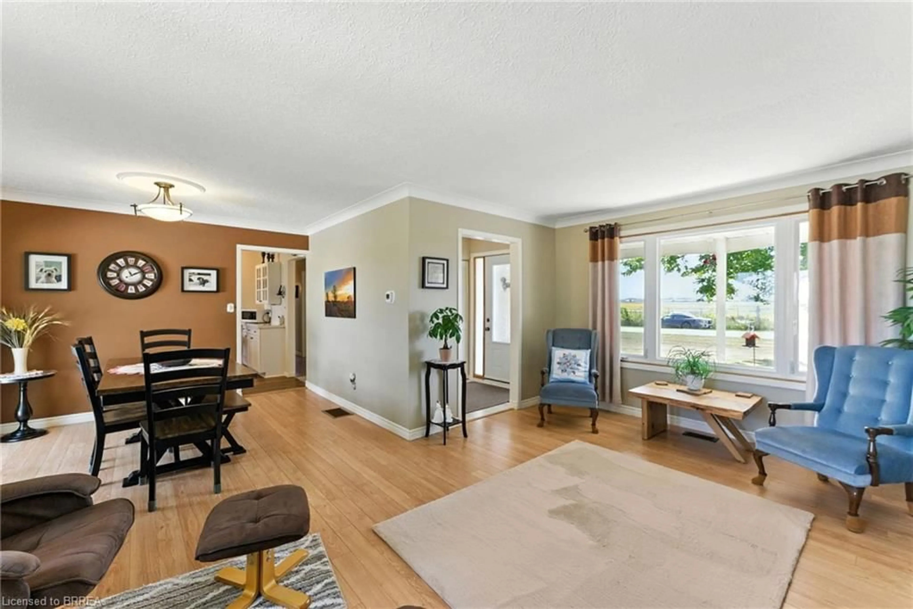 Living room with furniture, wood/laminate floor for 207 Robinson Rd, Brantford Ontario N3T 5L7