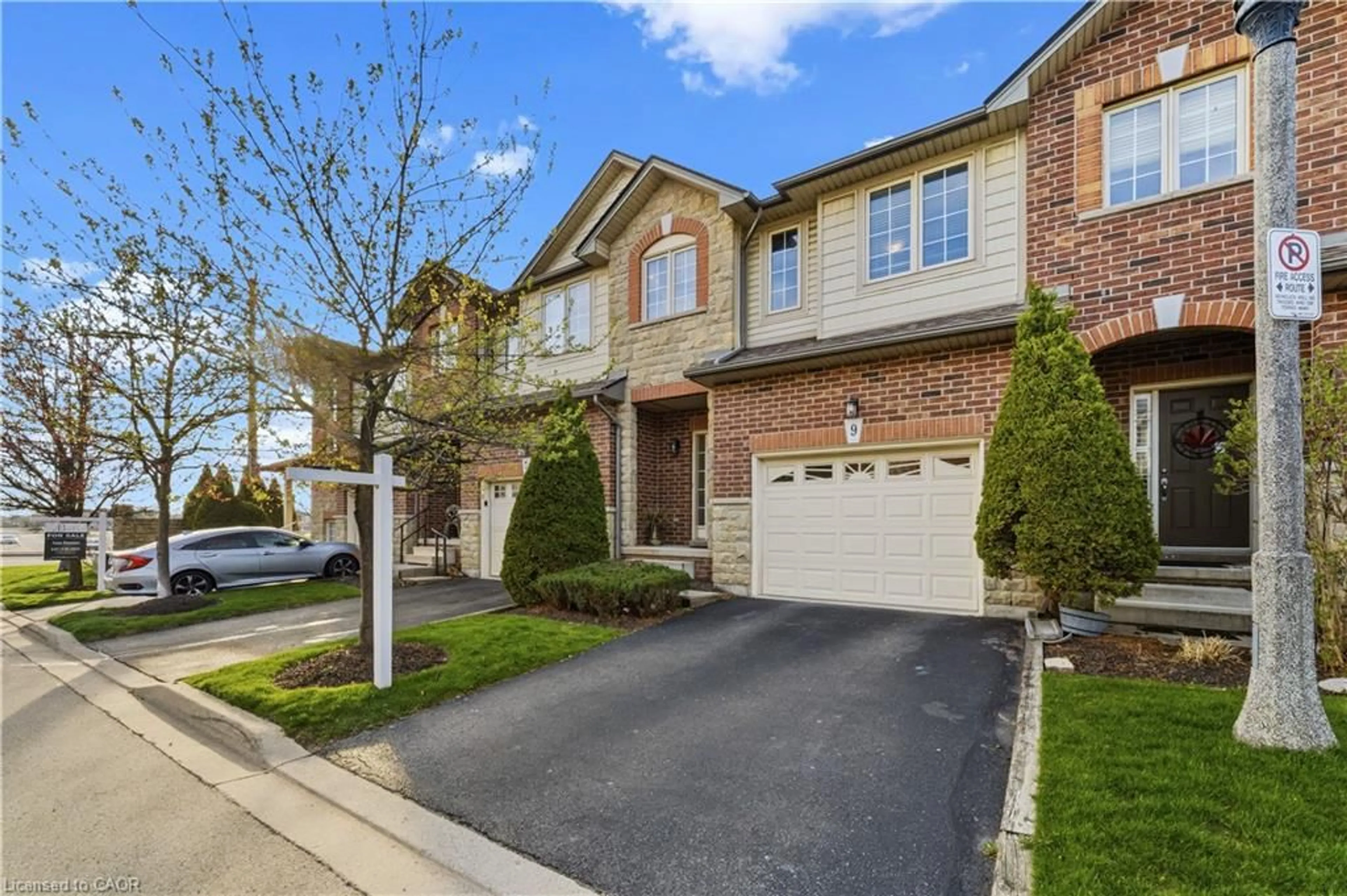 Home with brick exterior material, street for 9 Liddycoat Lane #18, Ancaster Ontario L9G 0A7