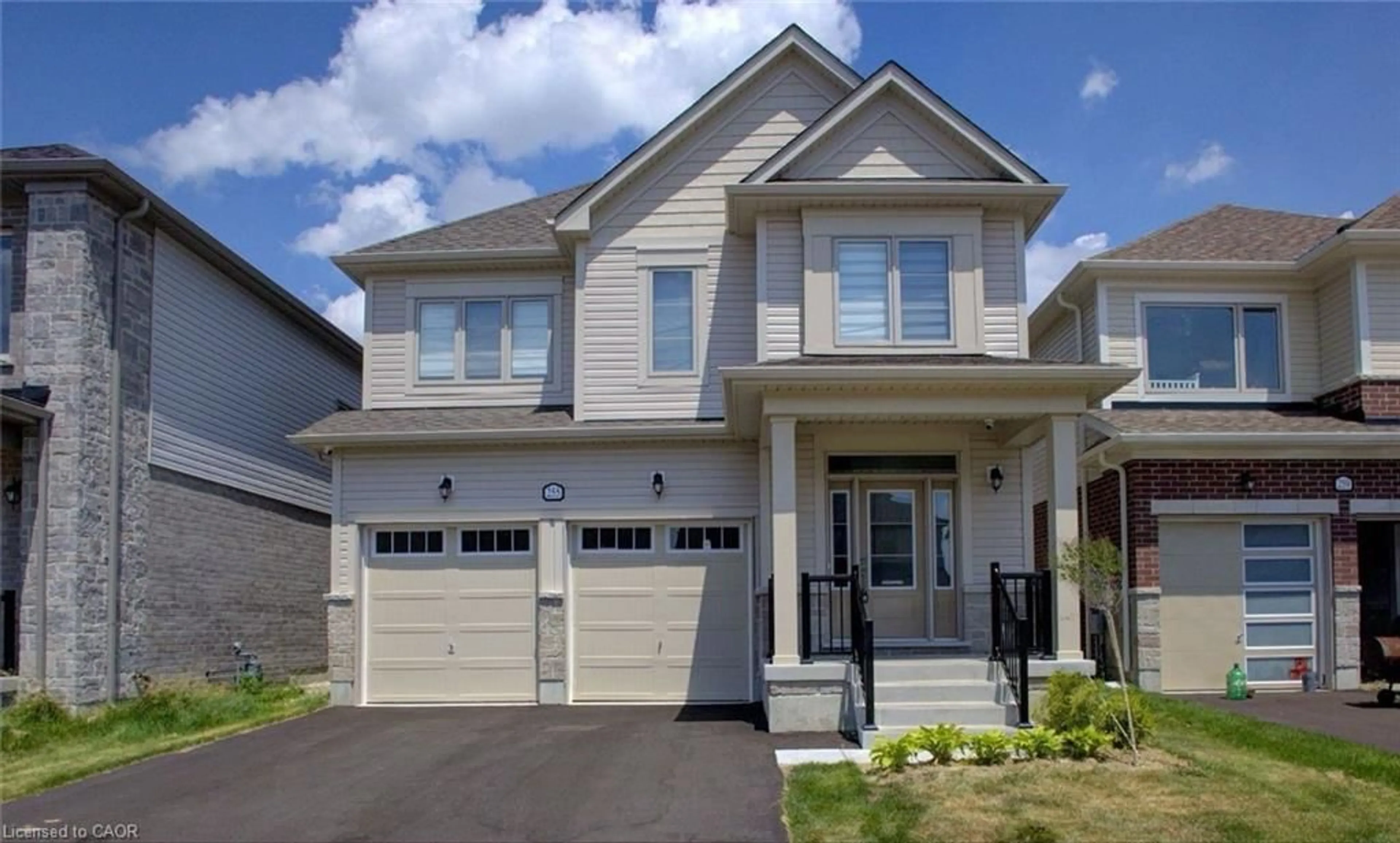 Home with vinyl exterior material, street for 255 Rea Dr, Centre Wellington Ontario N1M 0K1