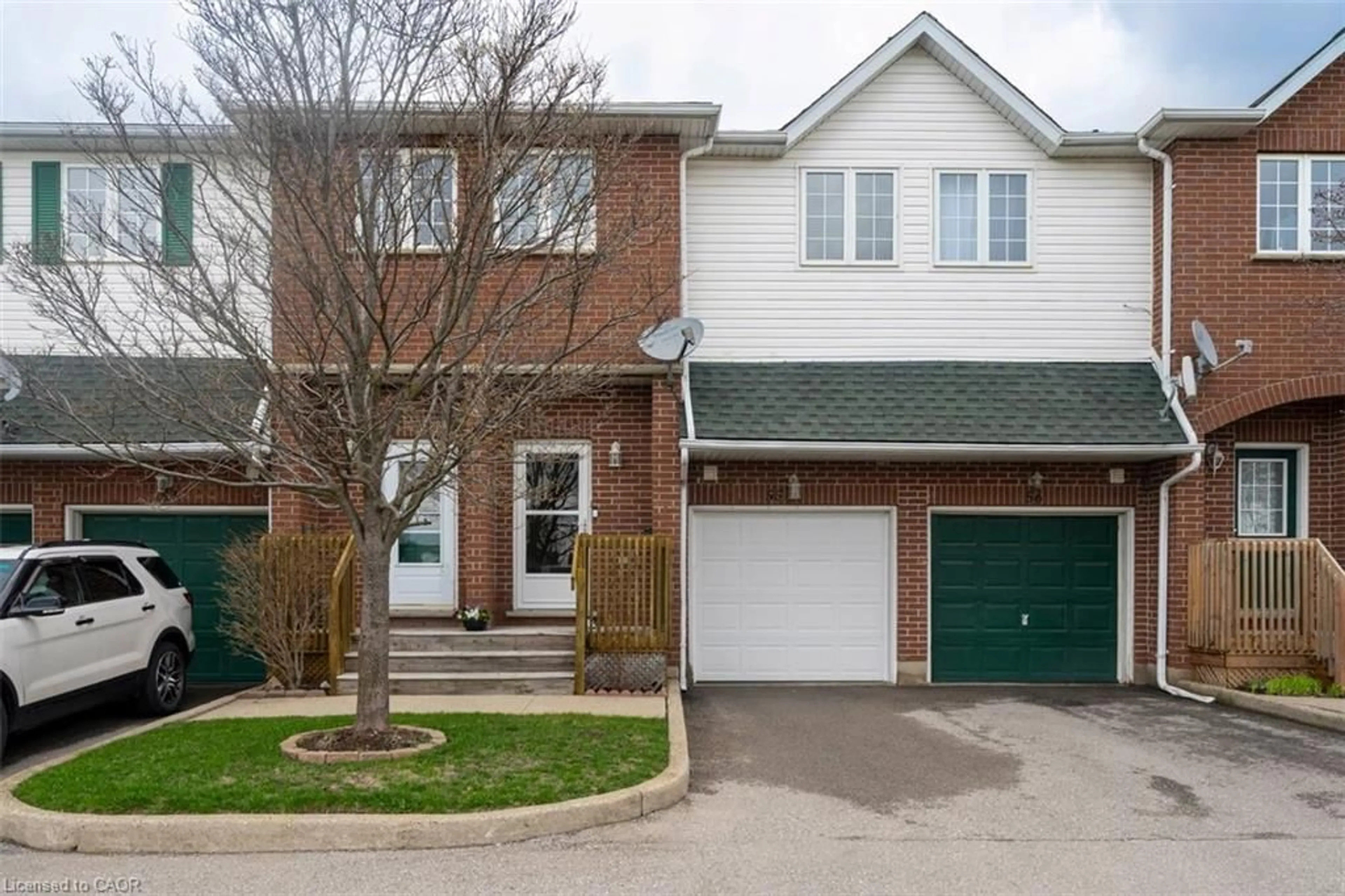 Home with brick exterior material, street for 42 Green Valley Dr #55, Kitchener Ontario N2P 2J7