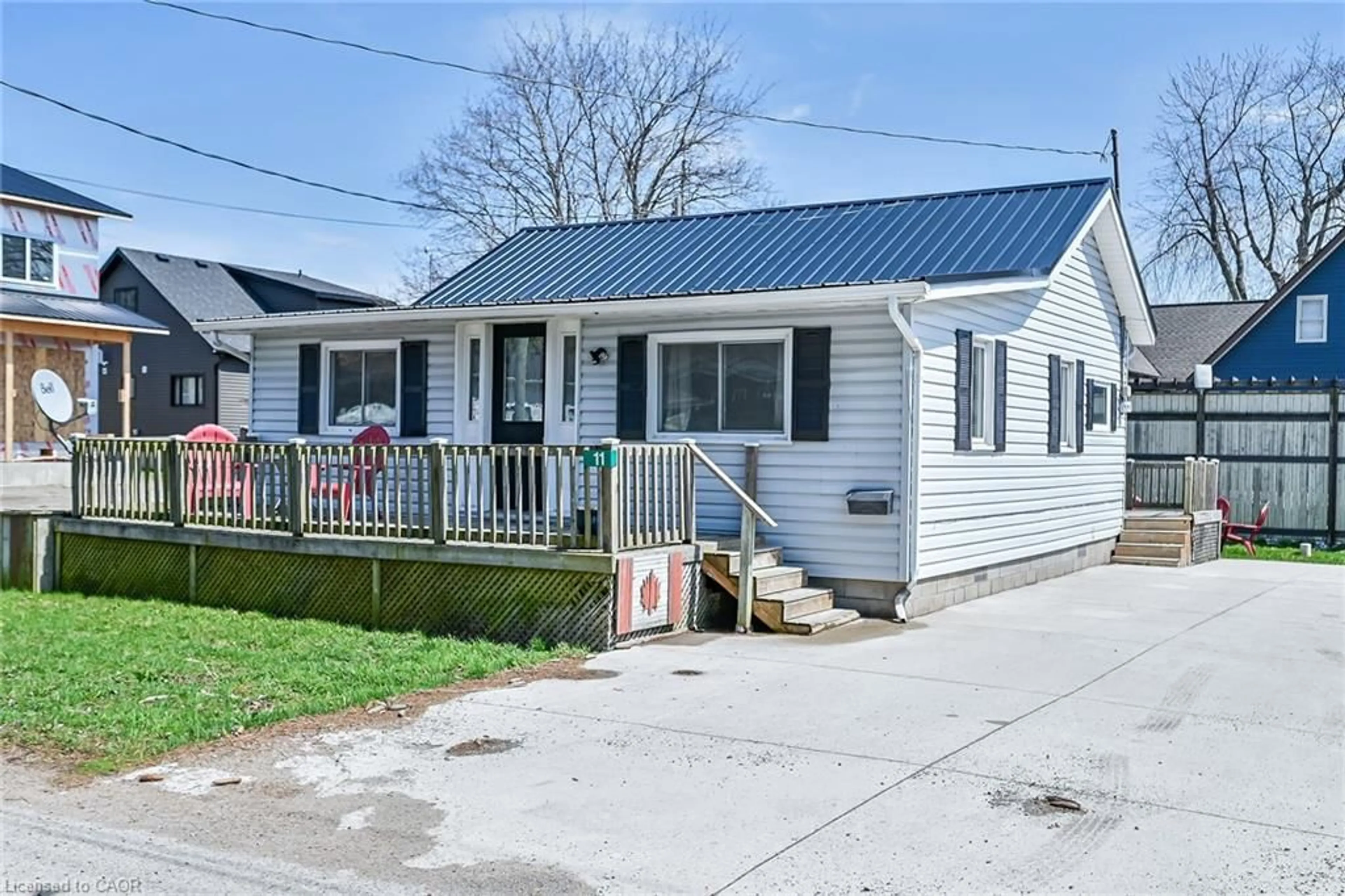 Home with vinyl exterior material, street for 11 Walter St, Turkey Point Ontario N0E 1T0