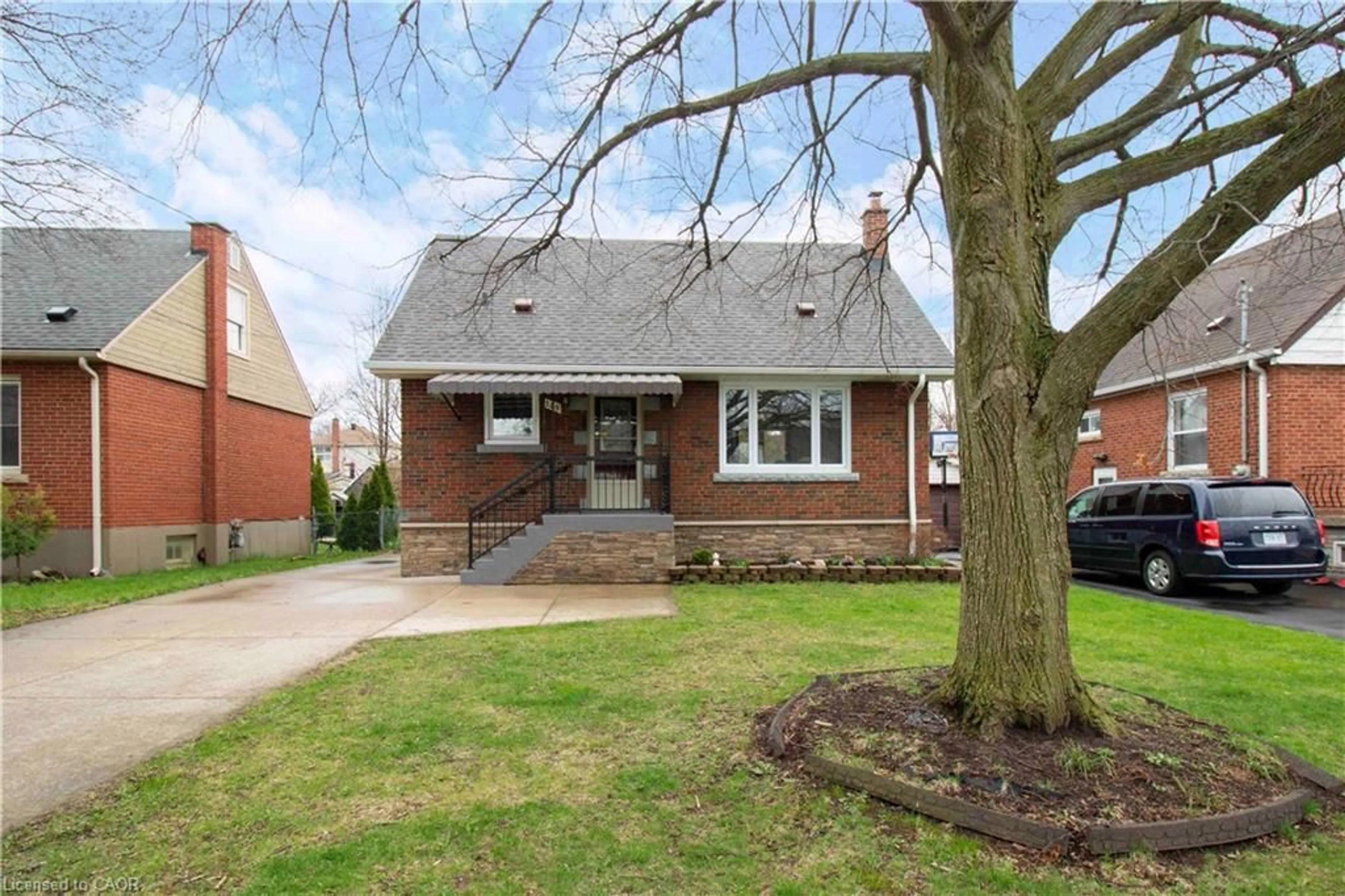 Home with brick exterior material, street for 149 34th St, Hamilton Ontario L8V 3W7