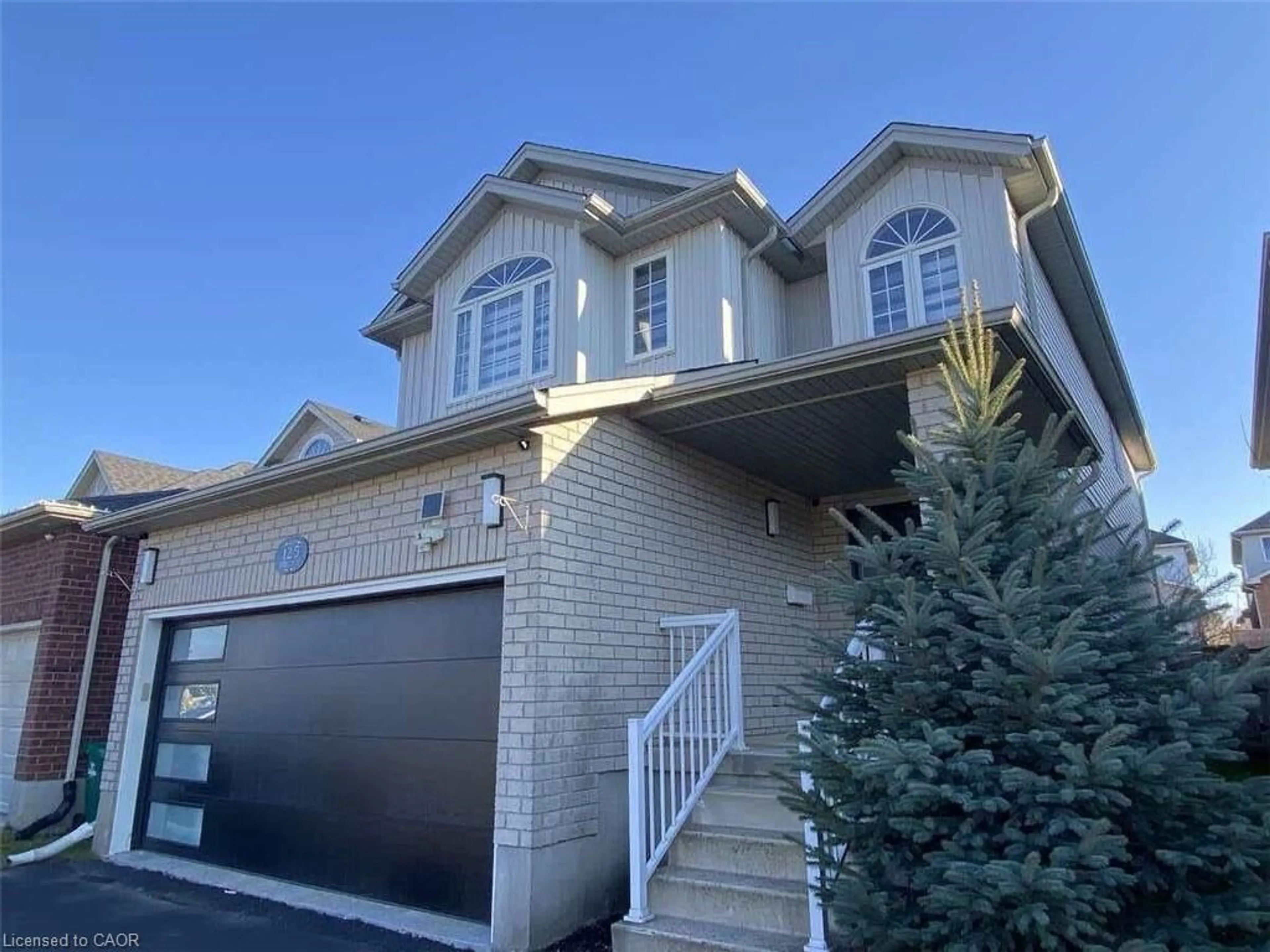 Home with vinyl exterior material, street for 125 Steepleridge St, Kitchener Ontario N2P 2W2