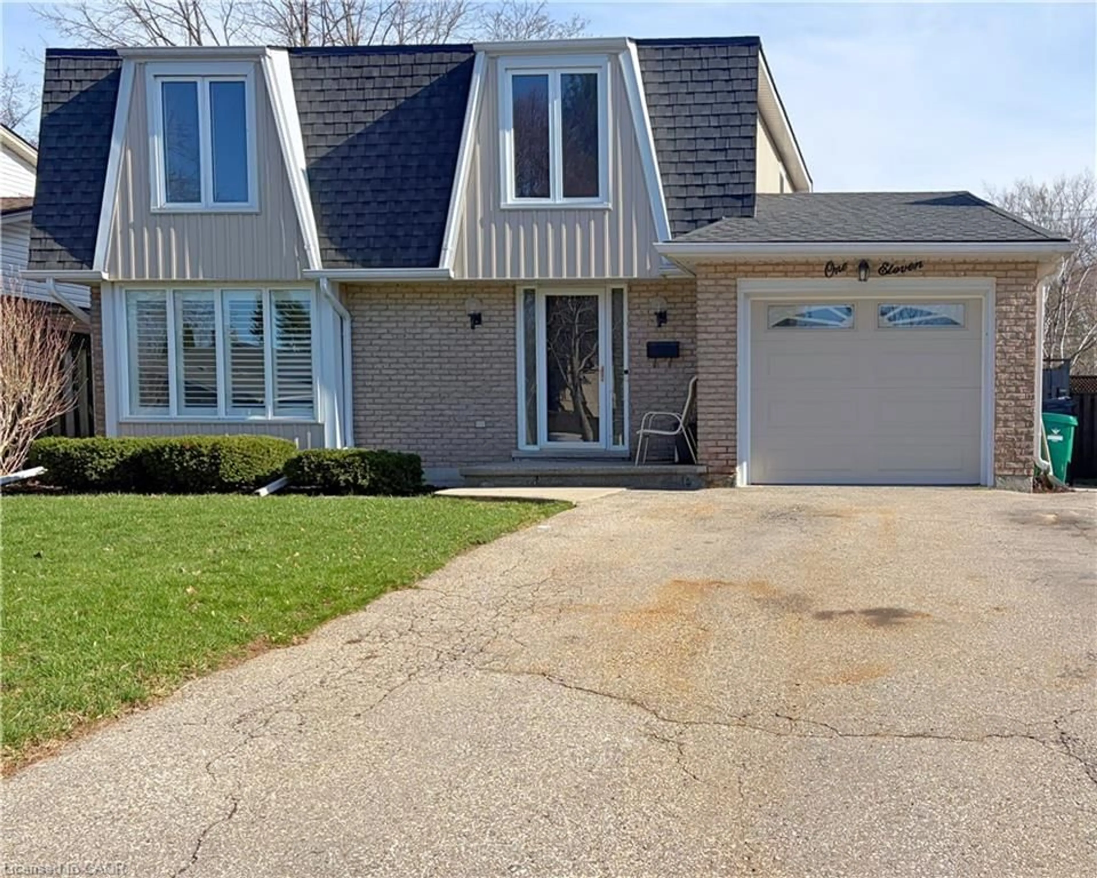 Home with vinyl exterior material, street for 111 Manor Dr, Kitchener Ontario N2A 2T9