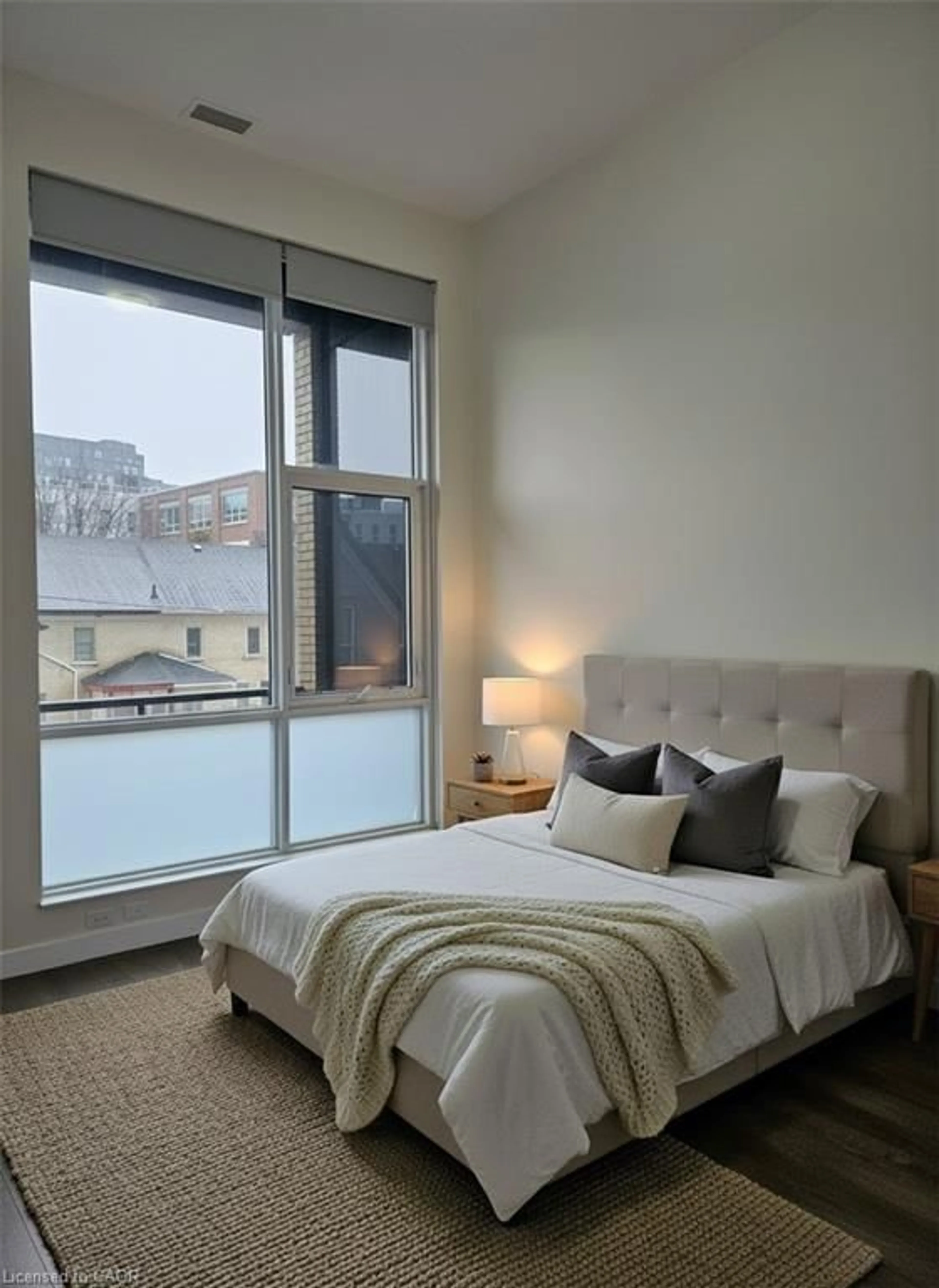 Bedroom with bed, unknown for 100 Garment St #211, Kitchener Ontario N2G 0C3