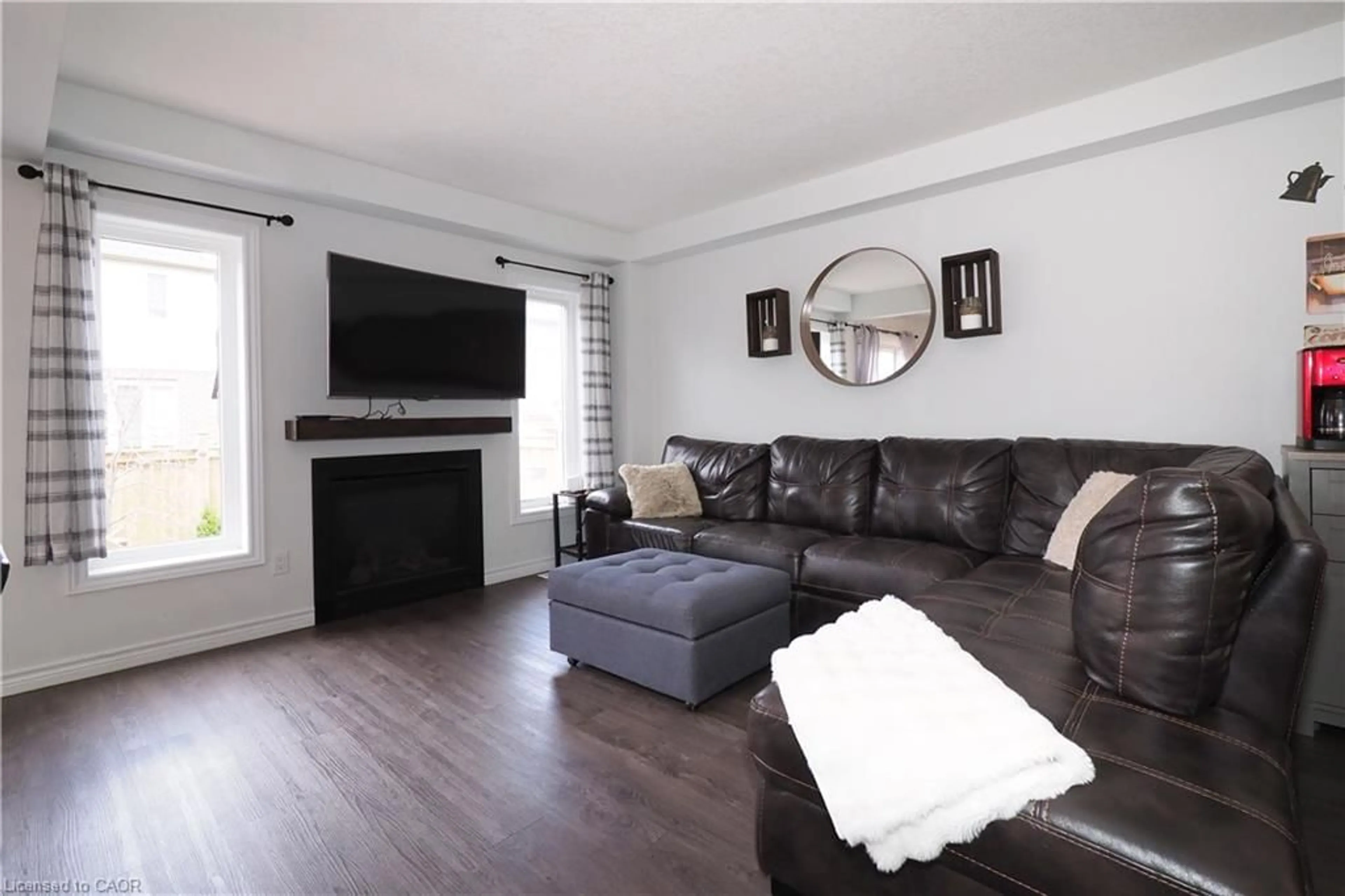 Living room with furniture, wood/laminate floor for 27 Gleason Cres, Kitchener Ontario N2M 0B7