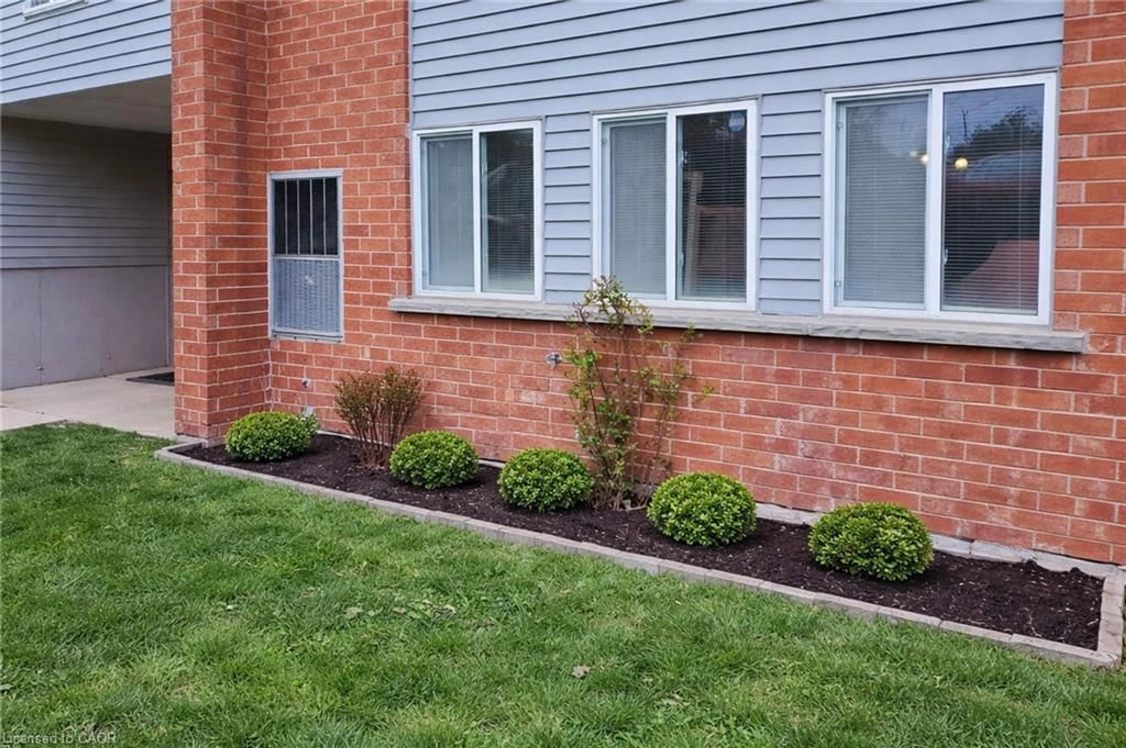 Home with brick exterior material, street for 500 Westmount Rd #103, Kitchener Ontario N2M 5M9