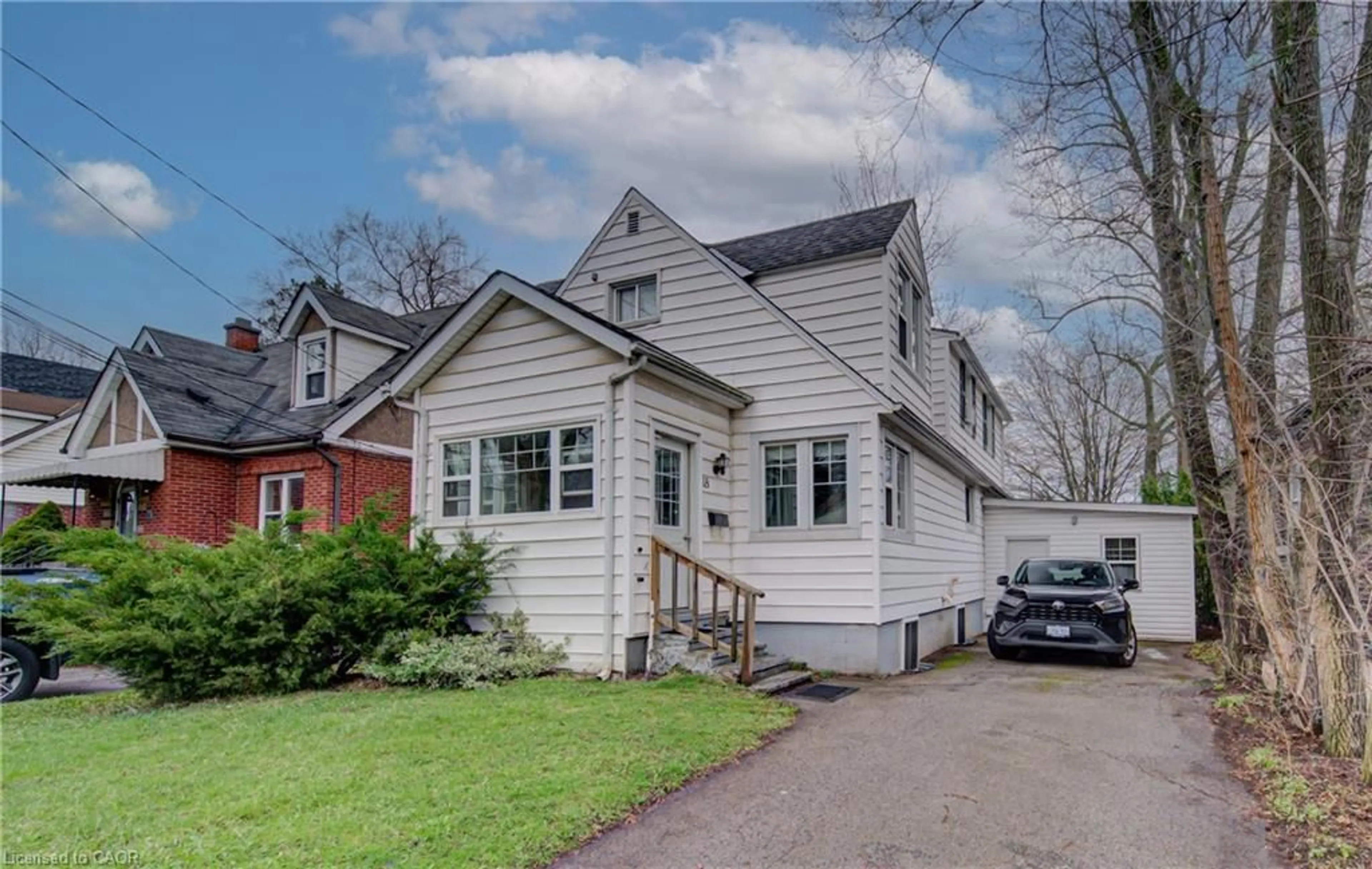 Home with vinyl exterior material, street for 18 Norfolk St, Hamilton Ontario L8S 3A5